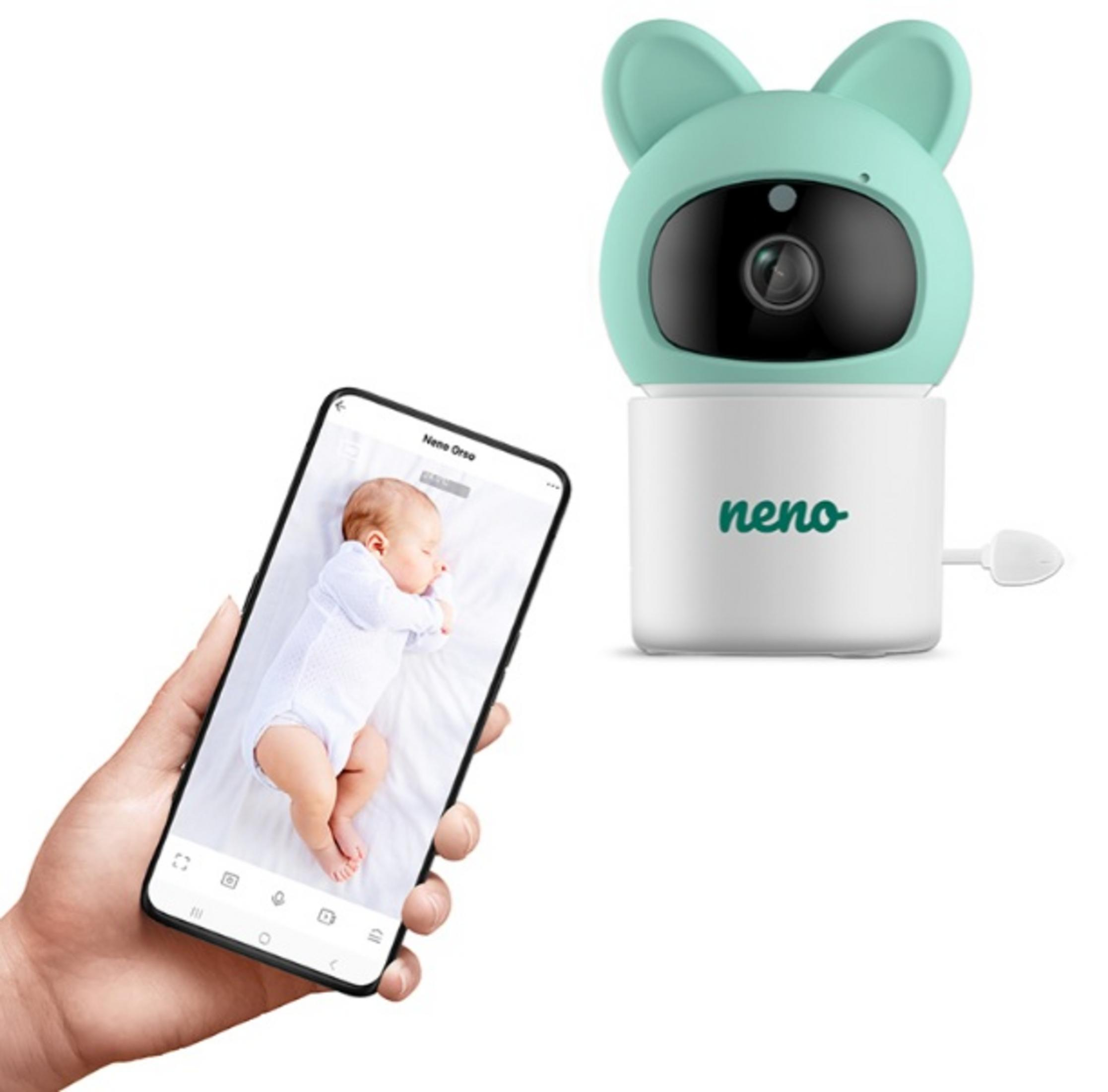 Ein Babyphone und ein Telefon zeigen ein schlafendes Baby. Der Monitor ist grün und weiß. Das Telefon ist in einer Hand.