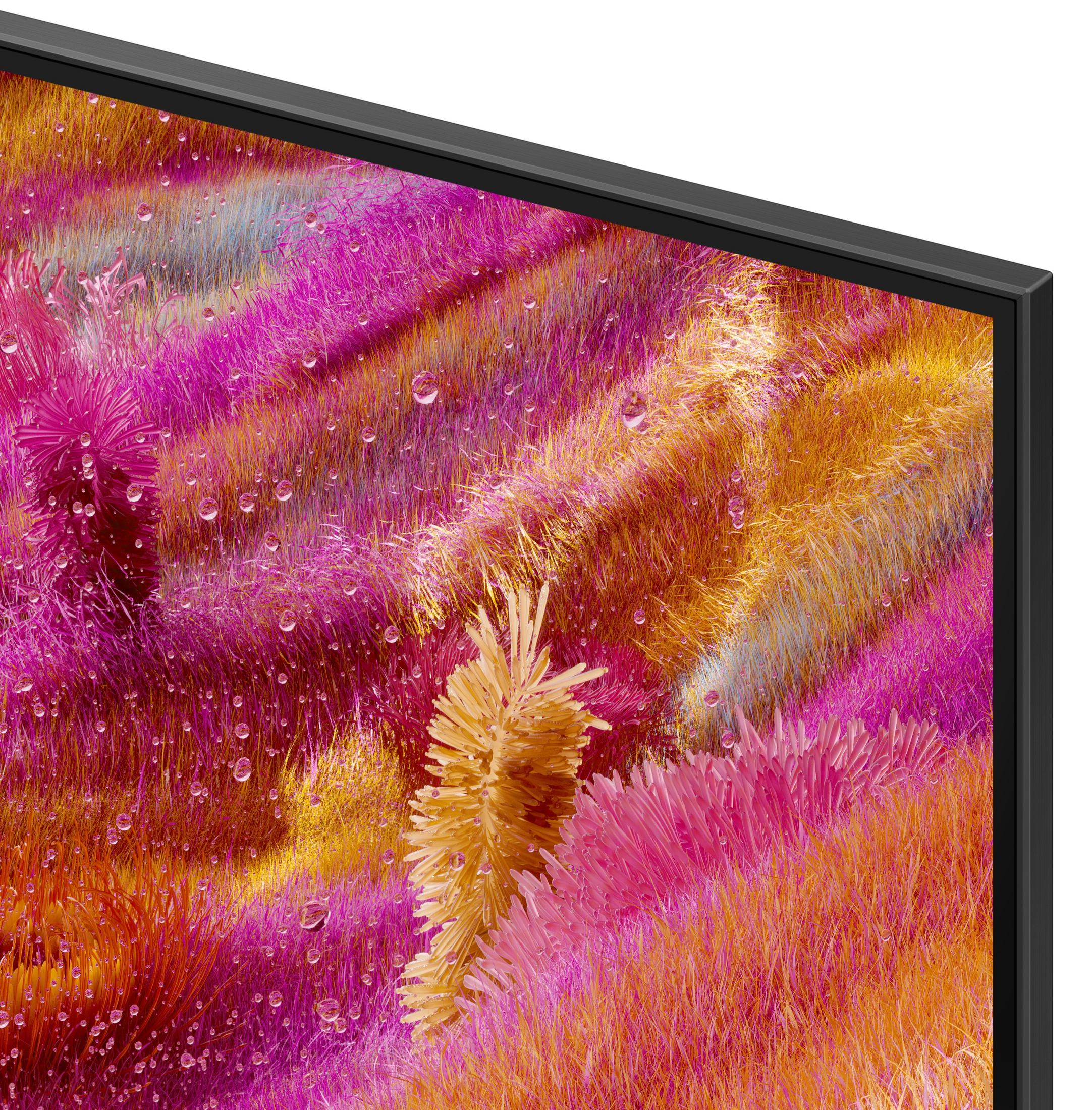 Primo piano di uno schermo che mostra arte astratta. Trame rosa, arancioni e gialle con goccioline d'acqua. Cornice nera visibile.