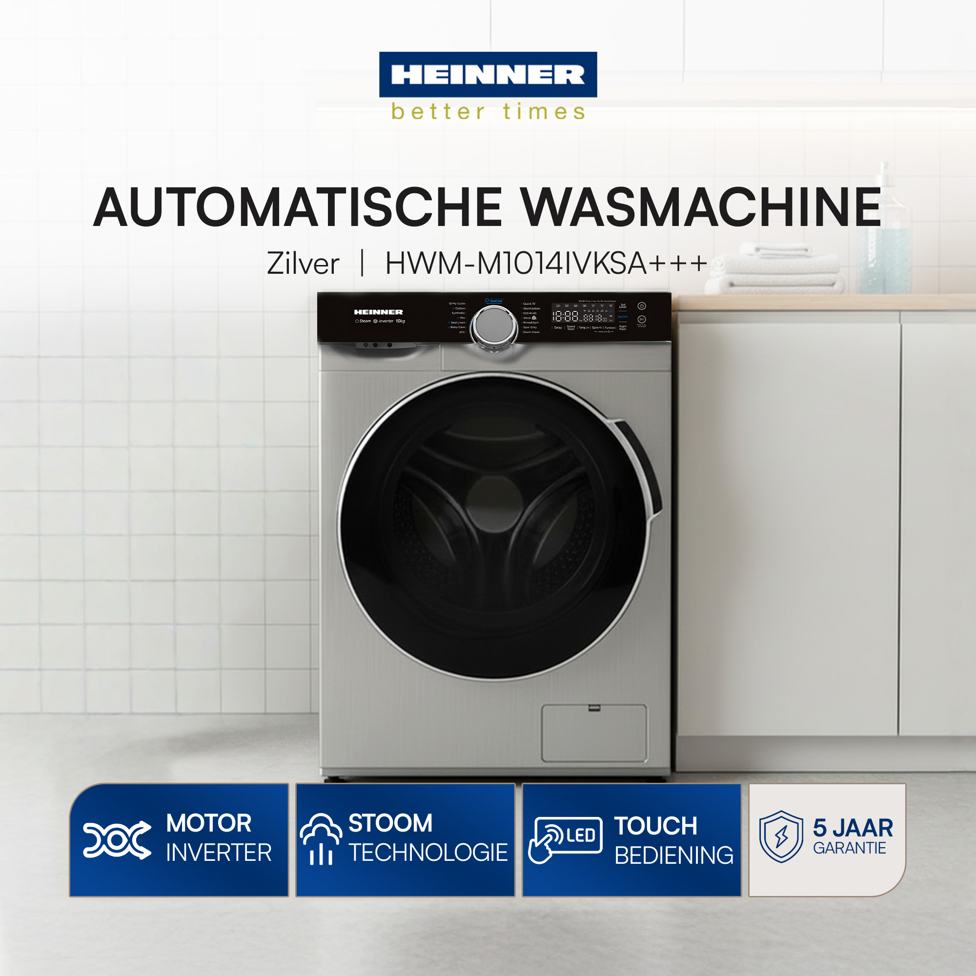 Silver washing machine with black control panel. Blue icons at the bottom. White tiles on the wall.
