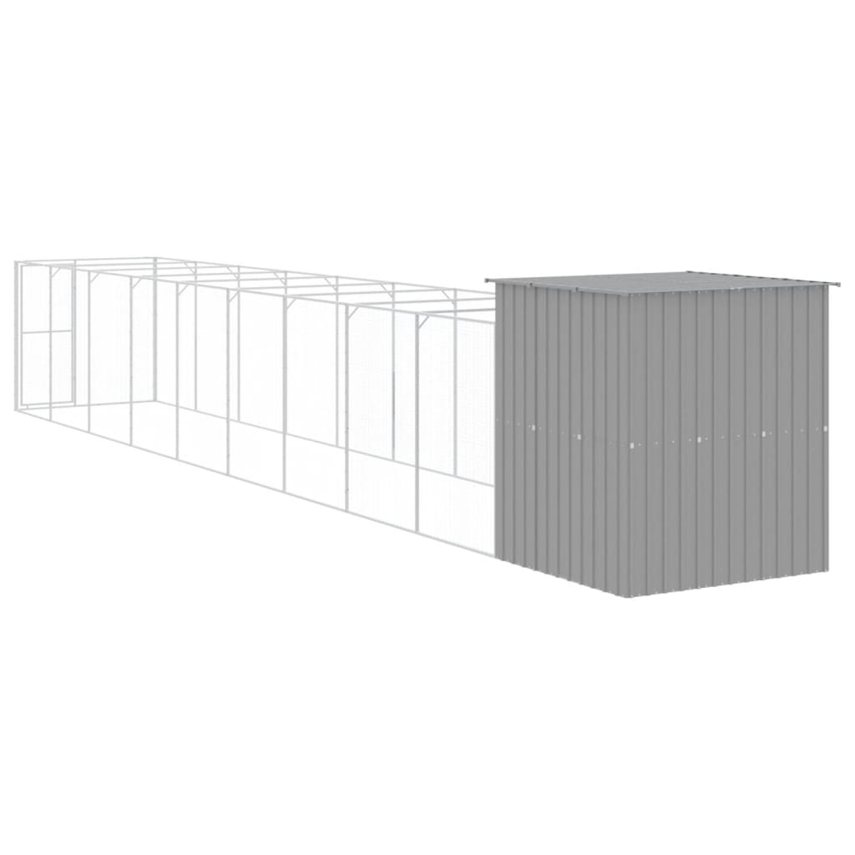 Ein graues Metallscheune mit einem langen, weißen Drahtgehäuse. Das Gehäuse ist rechteckig.