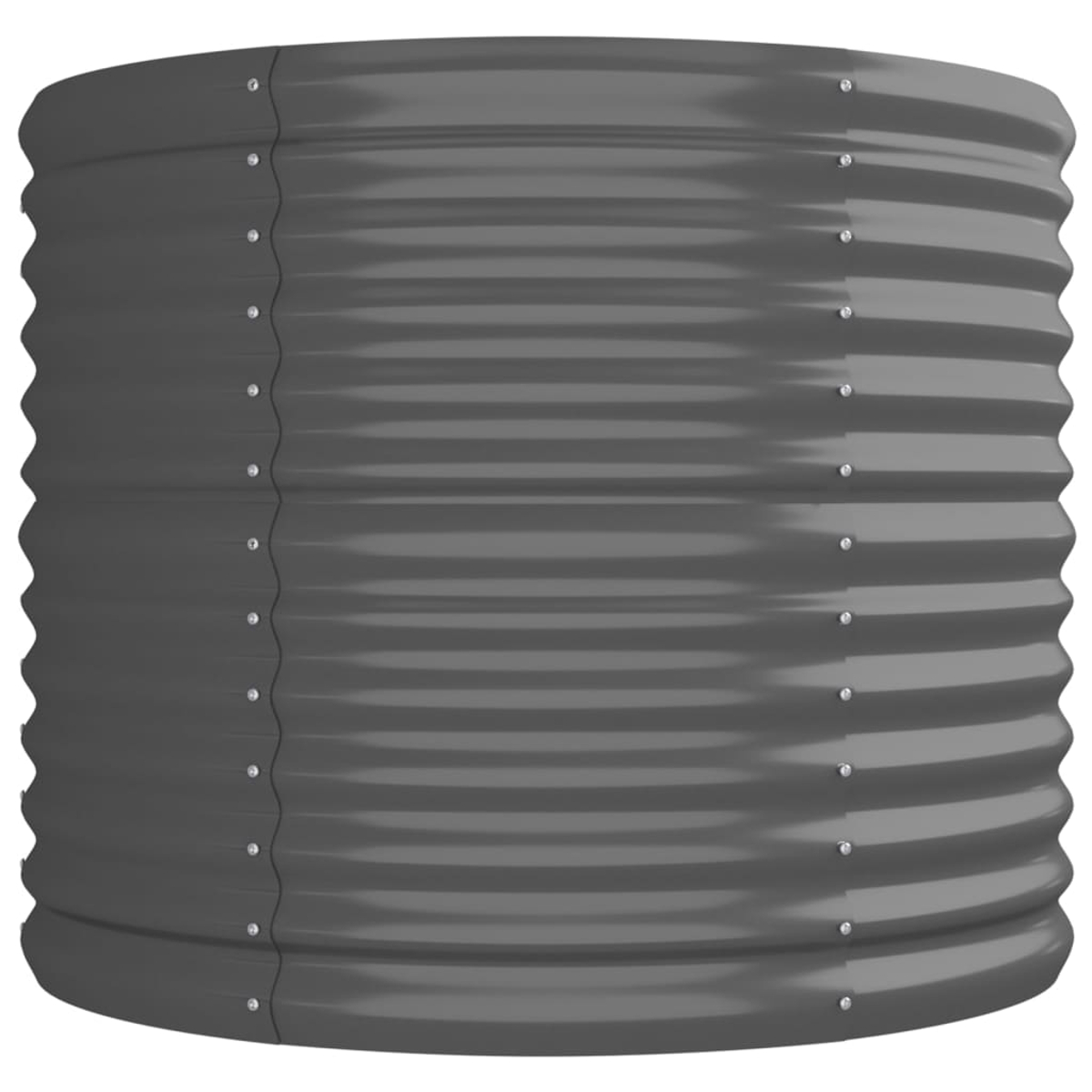 Ein grauer, gewellter Metallzylinder, wahrscheinlich ein erhöhtes Gartenbeet. Nieten sichern die Seitennähte. Die Kanten sind gebogen.