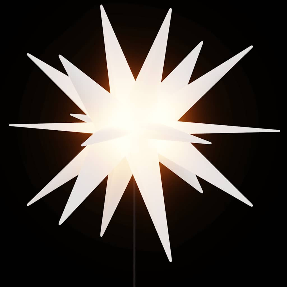 Eine weiße sternförmige Lampe mit mehreren Spitzen, von innen beleuchtet. Sie steht vor einem dunkelschwarzen Hintergrund.