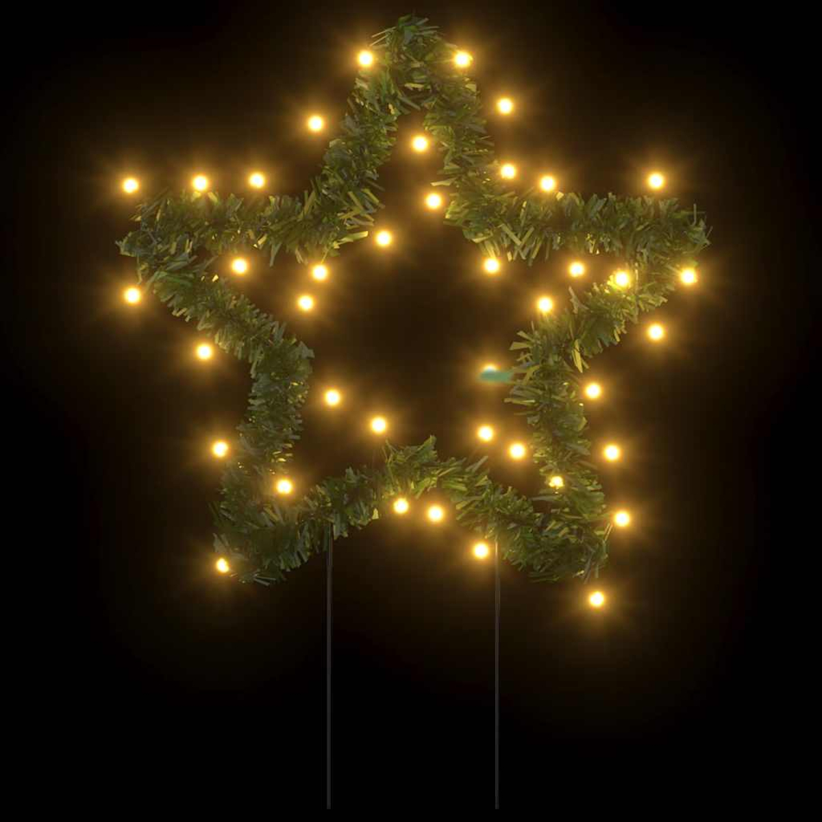 Sternförmige Weihnachtsdekoration mit grünem Girlande und gelben Lichtern vor schwarzem Hintergrund. Zwei Metallstäbe stützen sie.