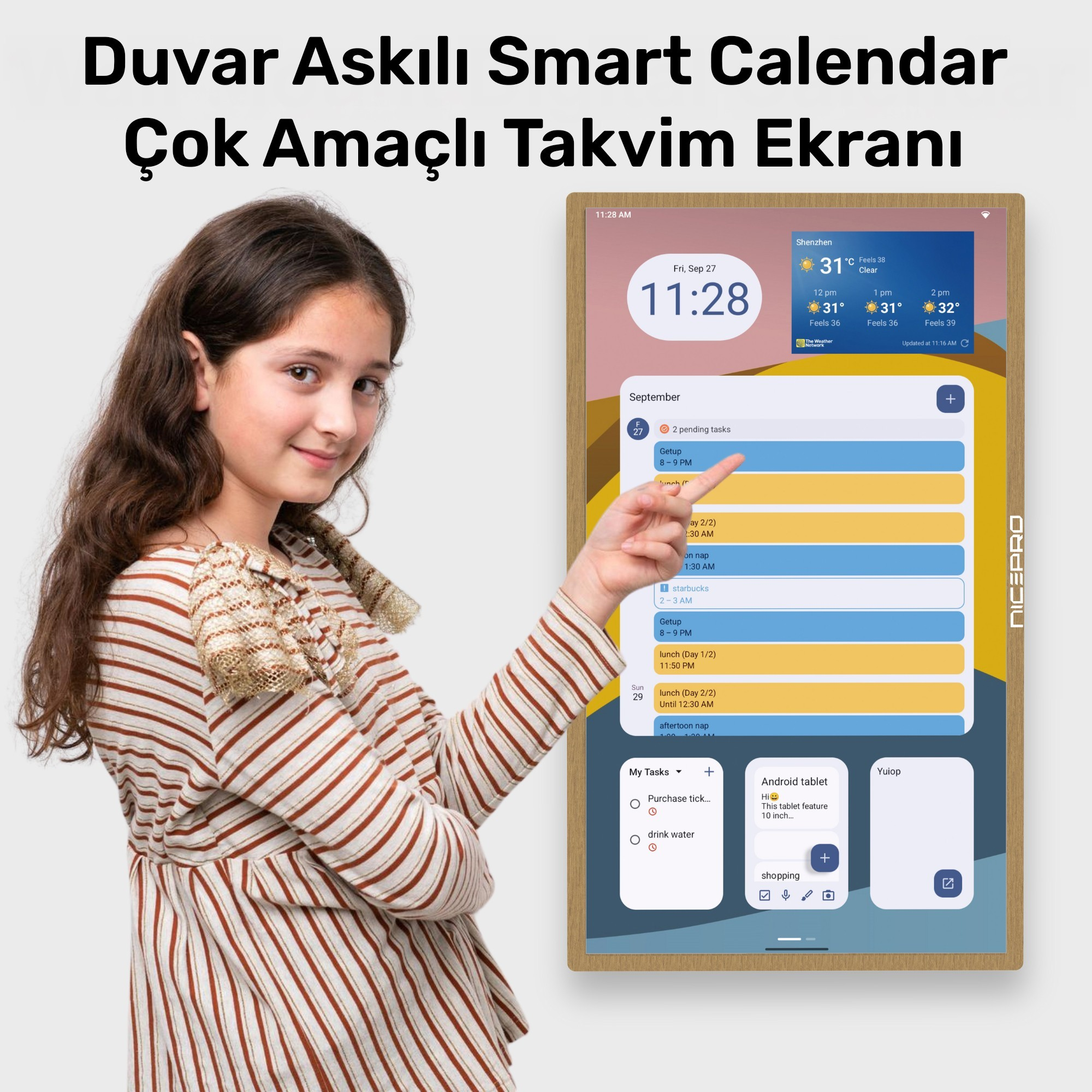 Bir kız, bir program gösteren akıllı bir takvimi işaret ediyor. Takvim görevleri, saati ve hava durumu bilgilerini gösteriyor.