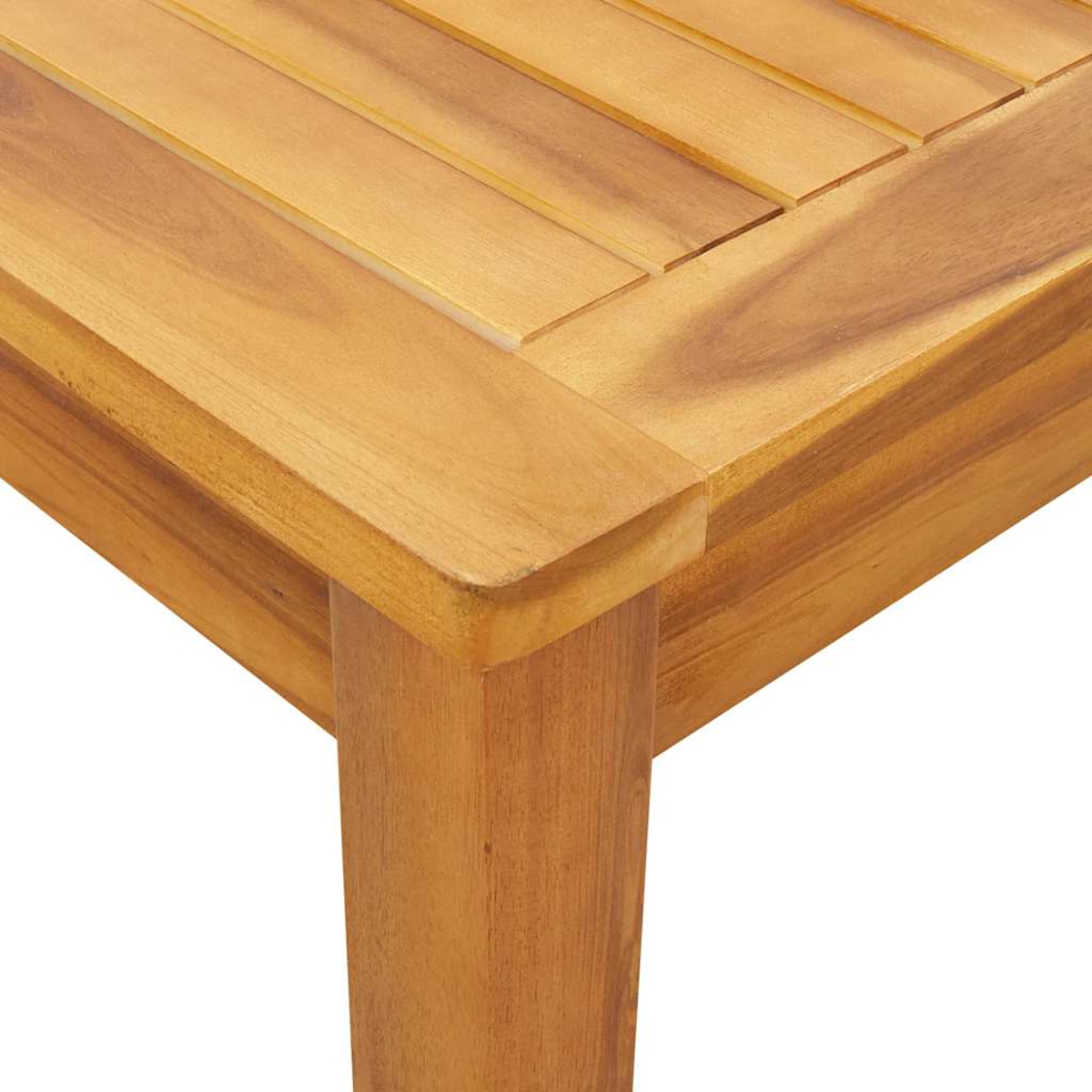 Nahaufnahme einer Holztischecke. Der Tisch besteht aus hellbraunem Holz mit sichtbarer Maserung. Ecke und Bein sind im Fokus.