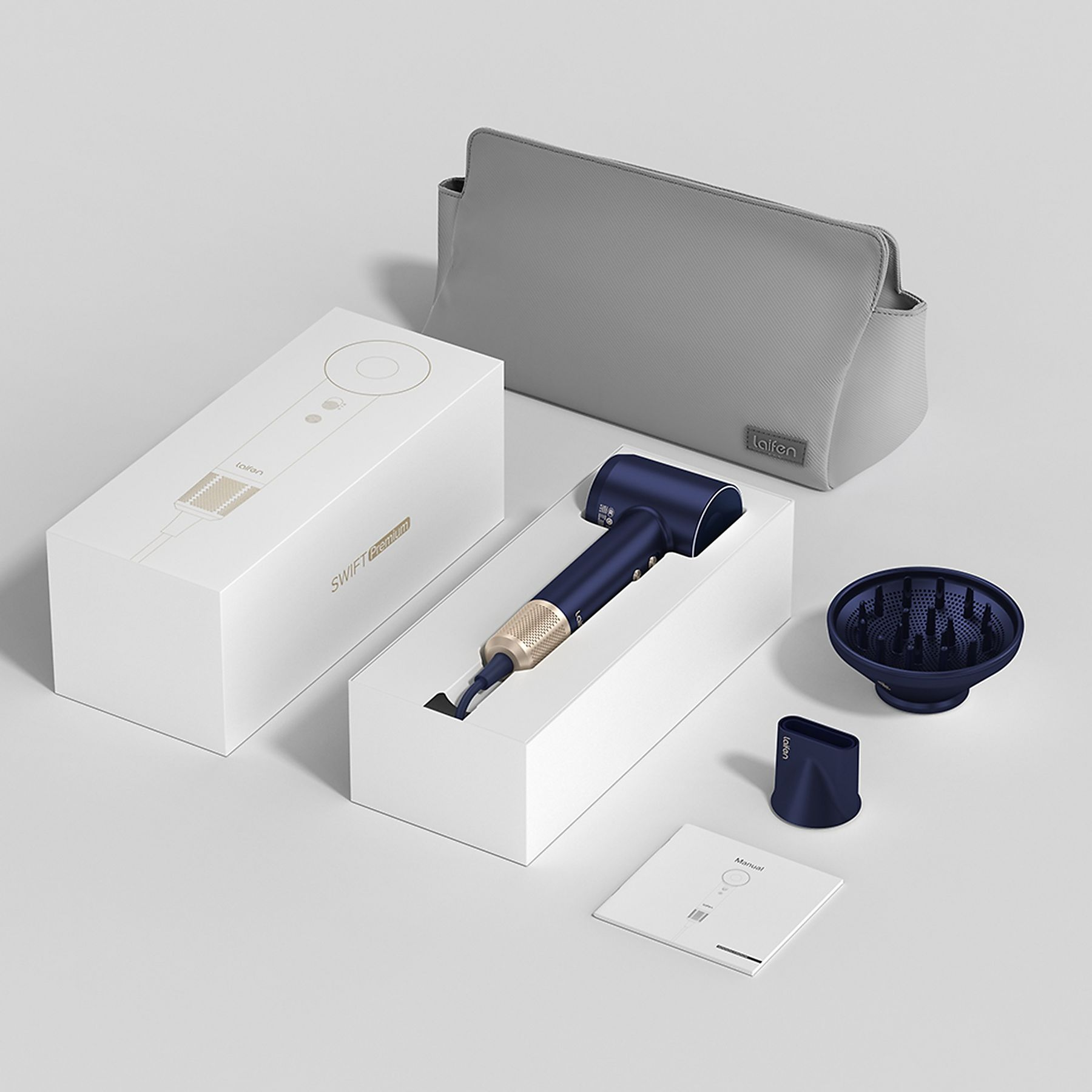Un set di asciugacapelli con asciugacapelli blu, scatola, borsa e accessori, il tutto su una superficie bianca.