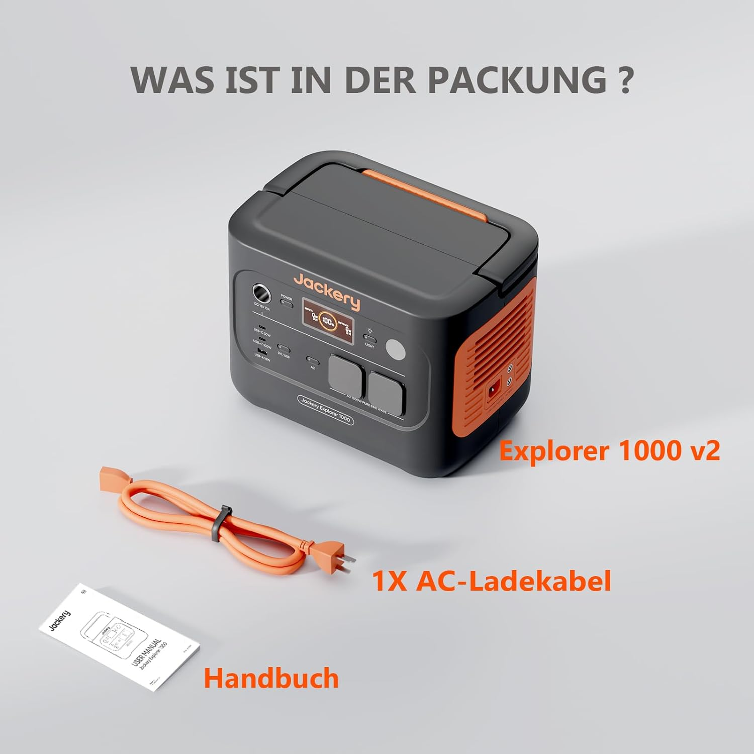 Ein Jackery Explorer 1000 v2 mit AC-Ladekabel und Benutzerhandbuch auf weißer Oberfläche. Das Produkt ist schwarz und orange.