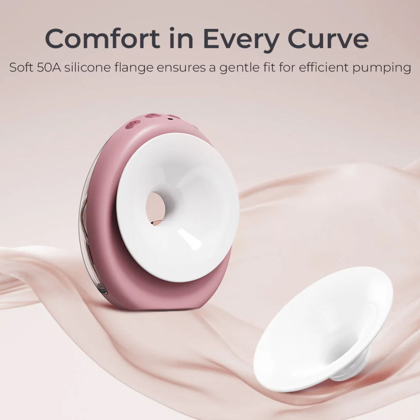 A pink breast pump with a white flange, beside a detached flange, on a pink fabric background.