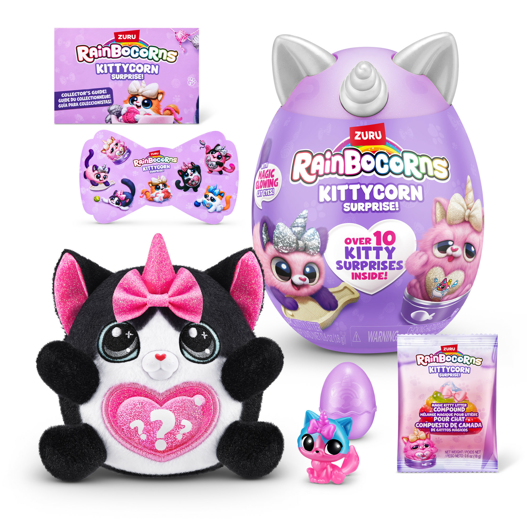 Das Bild zeigt ein Rainbocorns Kittycorn Surprise-Set. Enthält Plüsch, Ei, Anleitung und kleine Spielzeuge. Farben sind Pink, Lila und Schwarz.
