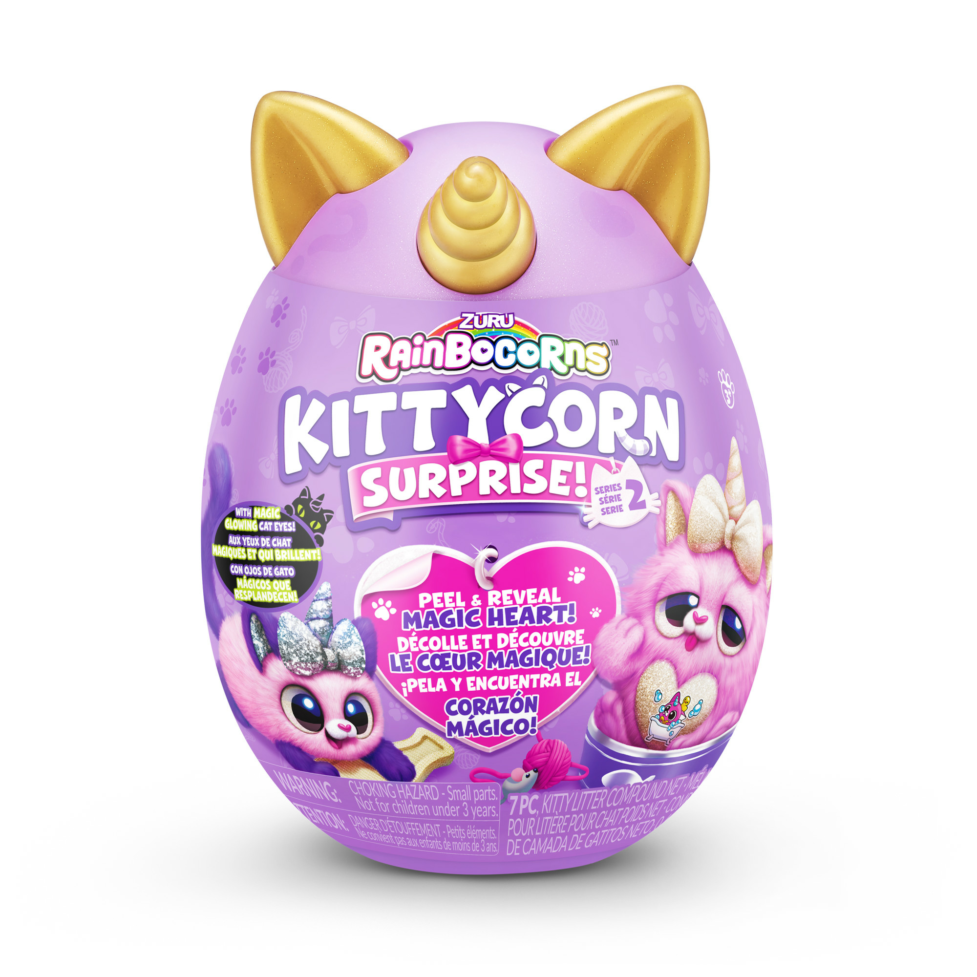 Ein lila eiförmiges Spielzeug mit goldenen Katzenohren und einem Einhornhorn, mit zwei rosa Plüschkatzenfiguren darauf.