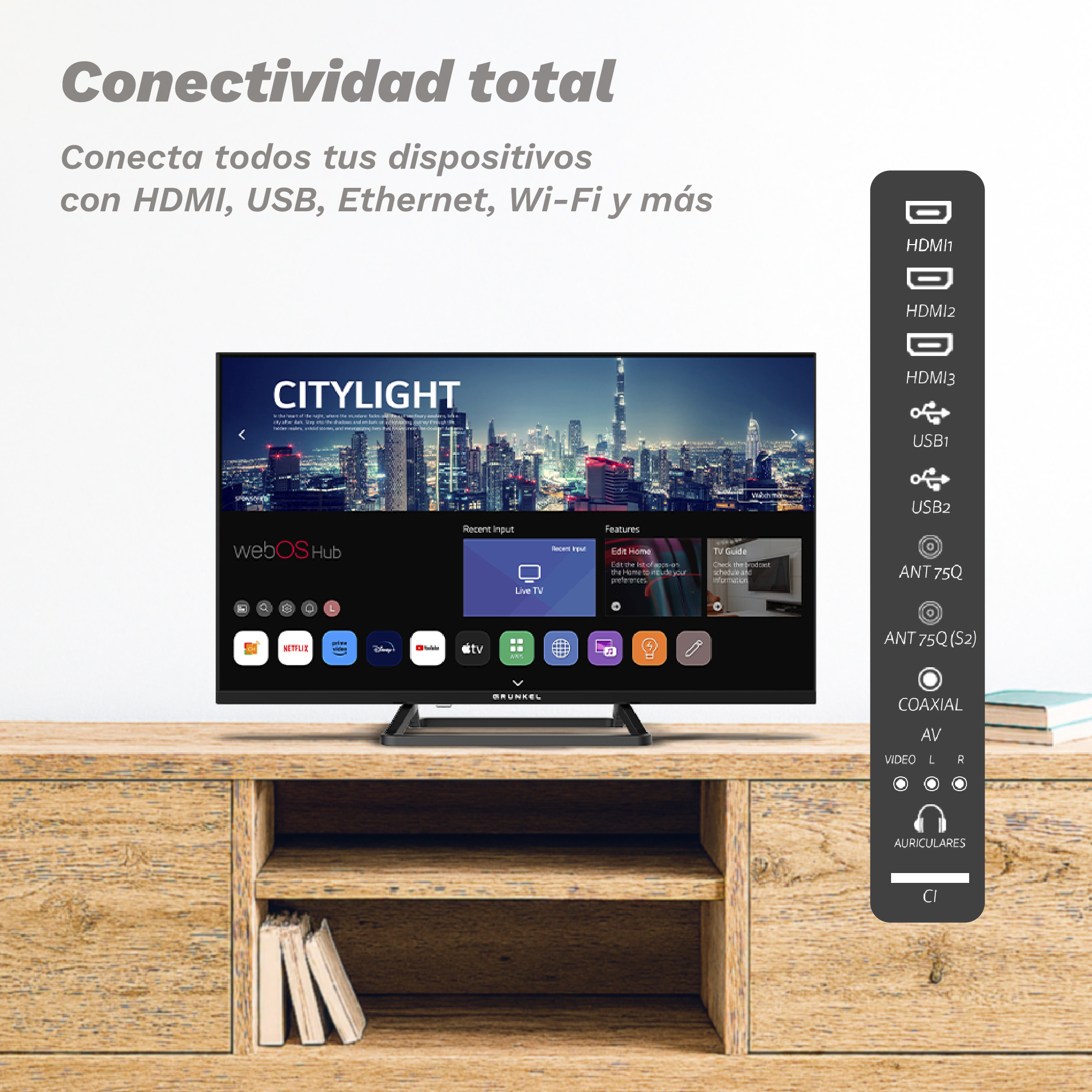 Televisor con pantalla de horizonte urbano. Está sobre un mueble de madera, con opciones de conexión a la derecha.