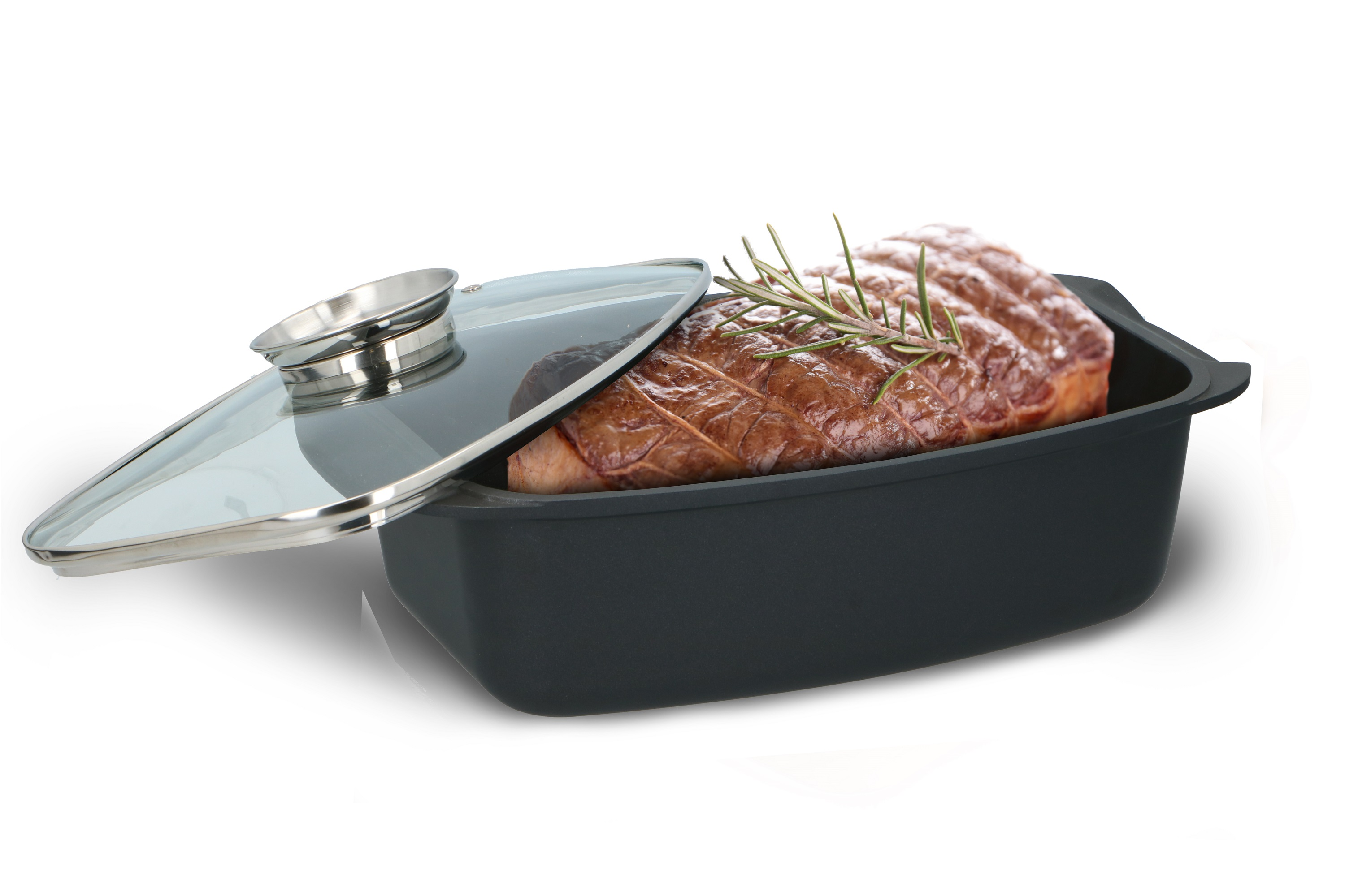 A roasted meat in a black baking dish with a glass lid and rosemary sprig on top.