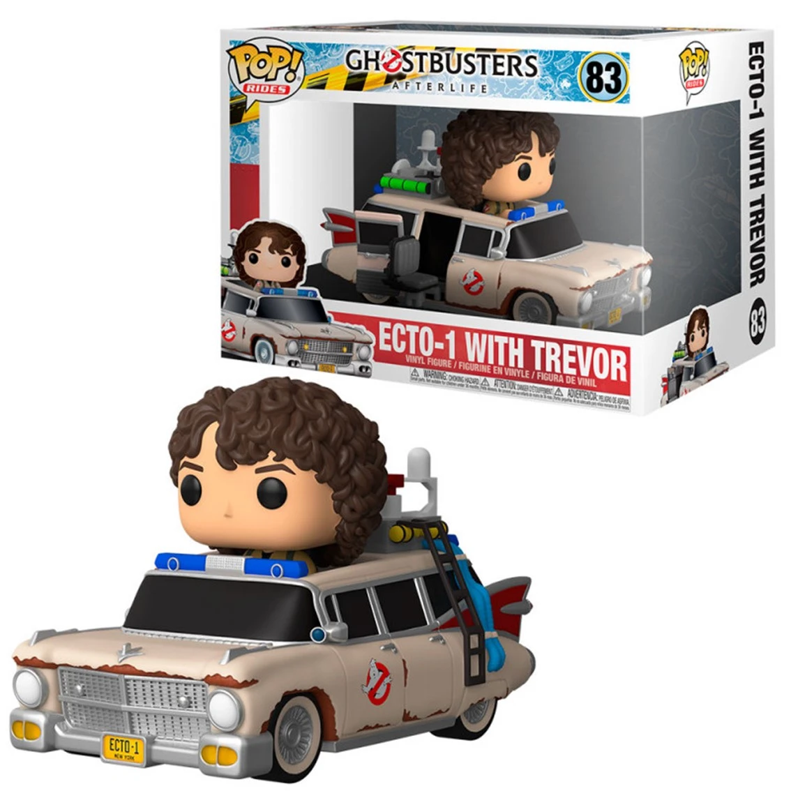 Ein Ghostbusters Ecto-1 Spielzeug mit Trevor darin. Das Spielzeug befindet sich in einer Box. Das Auto ist beige mit dem Ghostbusters-Logo.