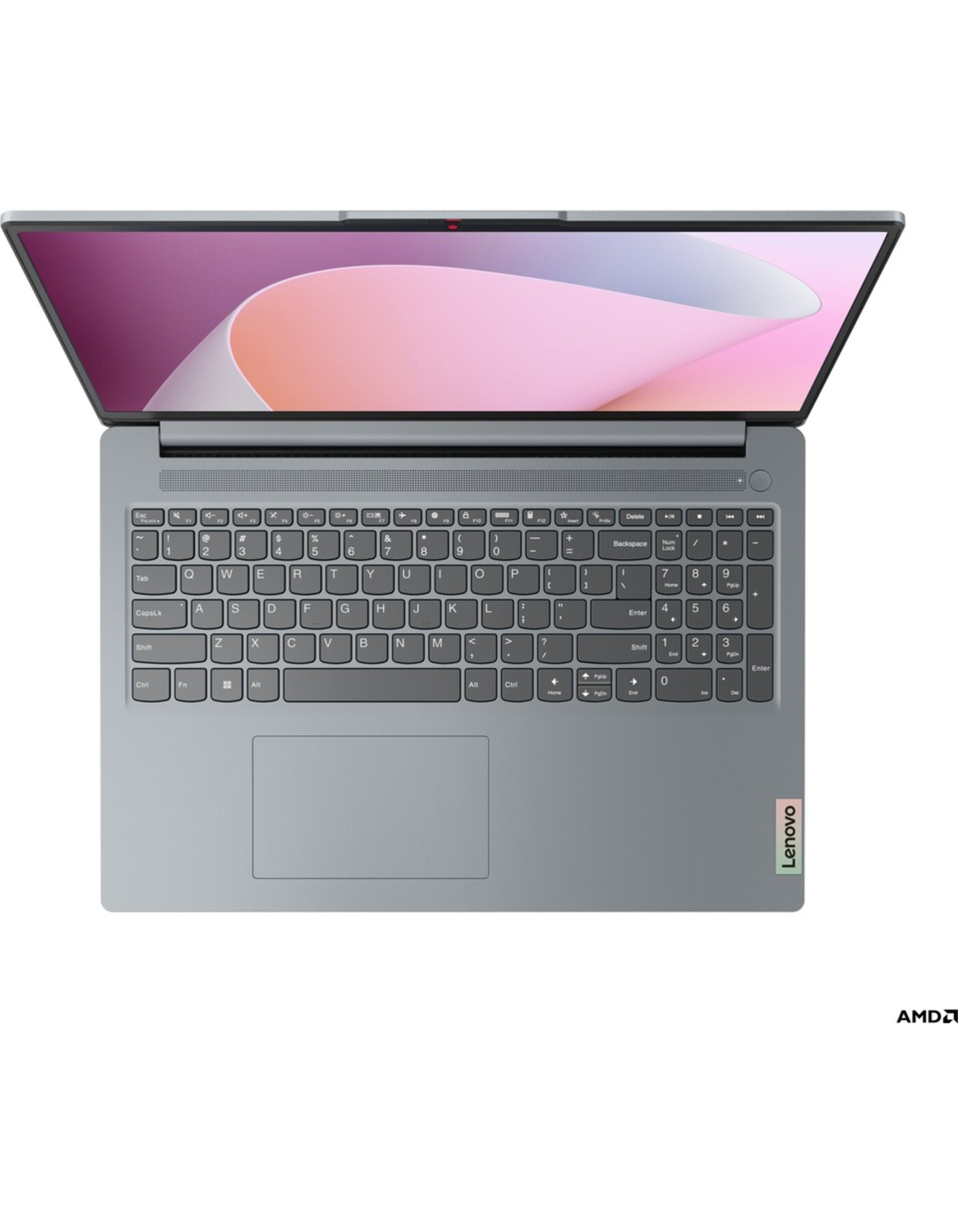 Açık dizüstü bilgisayar, gri renk. Klavye görünür, Lenovo logosuyla. Ekran pembe ve beyaz soyut tasarım gösteriyor.