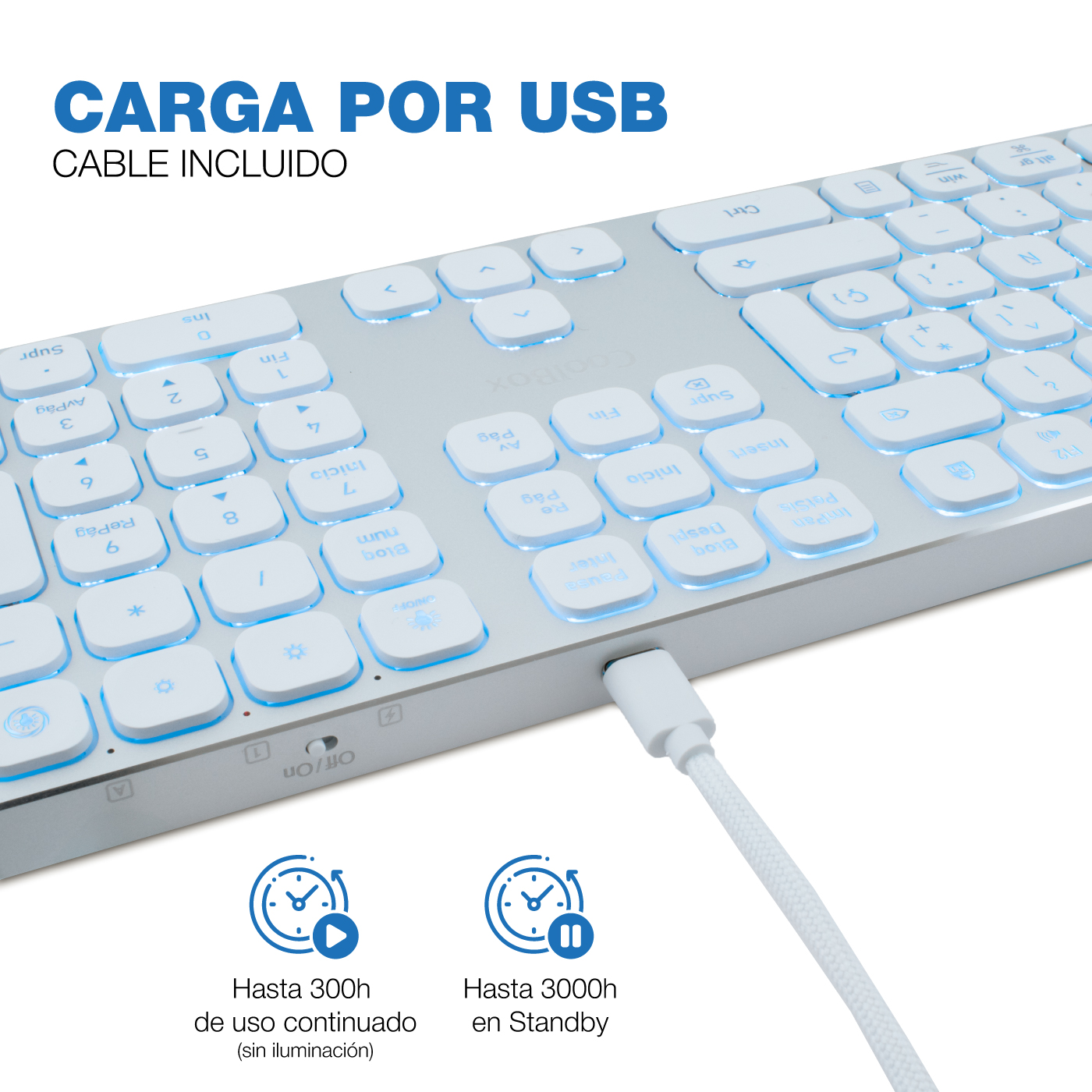 Un teclado blanco retroiluminado con un cable USB enchufado. El texto indica carga USB y larga duración de la batería.