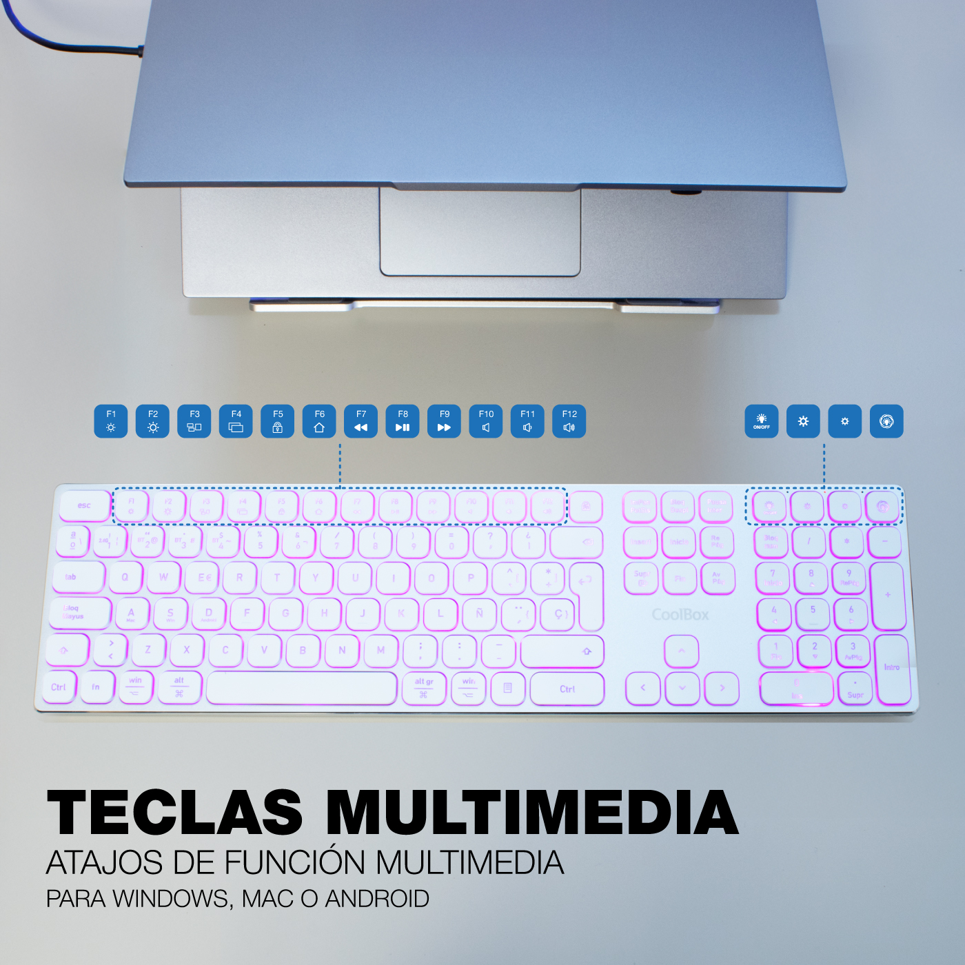 Un teclado blanco iluminado con una computadora portátil encima. Texto abajo: teclas multimedia para Windows, Mac o Android.