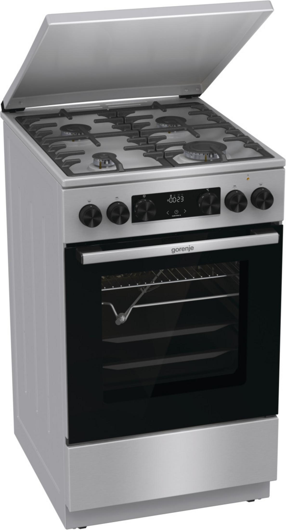 Un fornello Gorenje argentato con coperchio parzialmente aperto. Ha quattro fuochi, un forno e manopole.