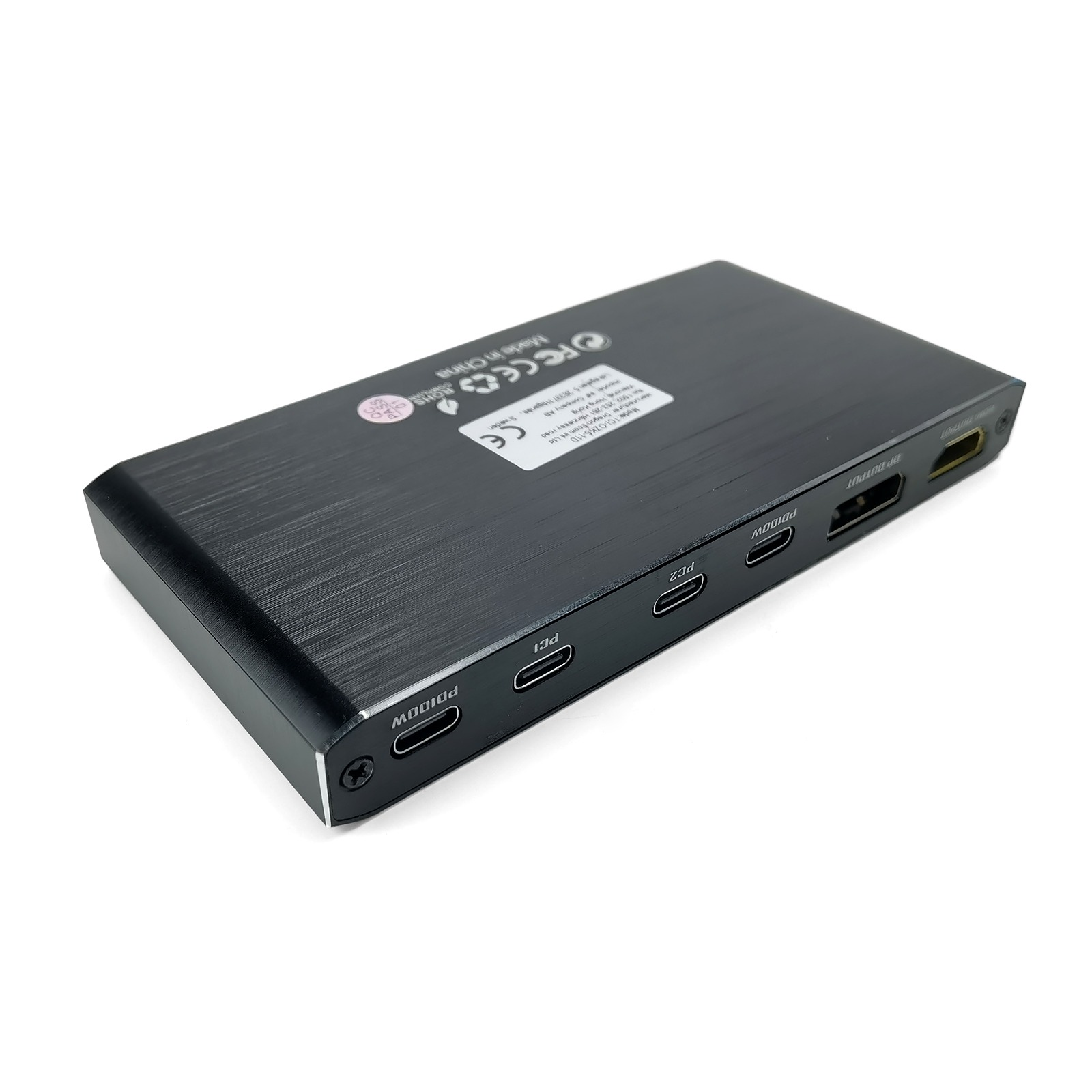 Ein schwarzes rechteckiges Gerät mit mehreren Anschlüssen: PD100W, PCI, PC2, DP OUTPUT und HDMI OUTPUT, vor weißem Hintergrund.
