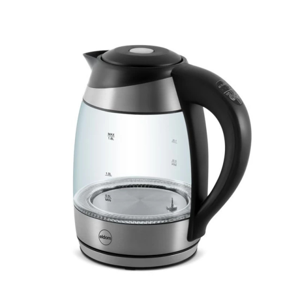 Un bollitore elettrico in vetro trasparente con manico e coperchio neri. Ha una base argentata e segni di livello dell'acqua.