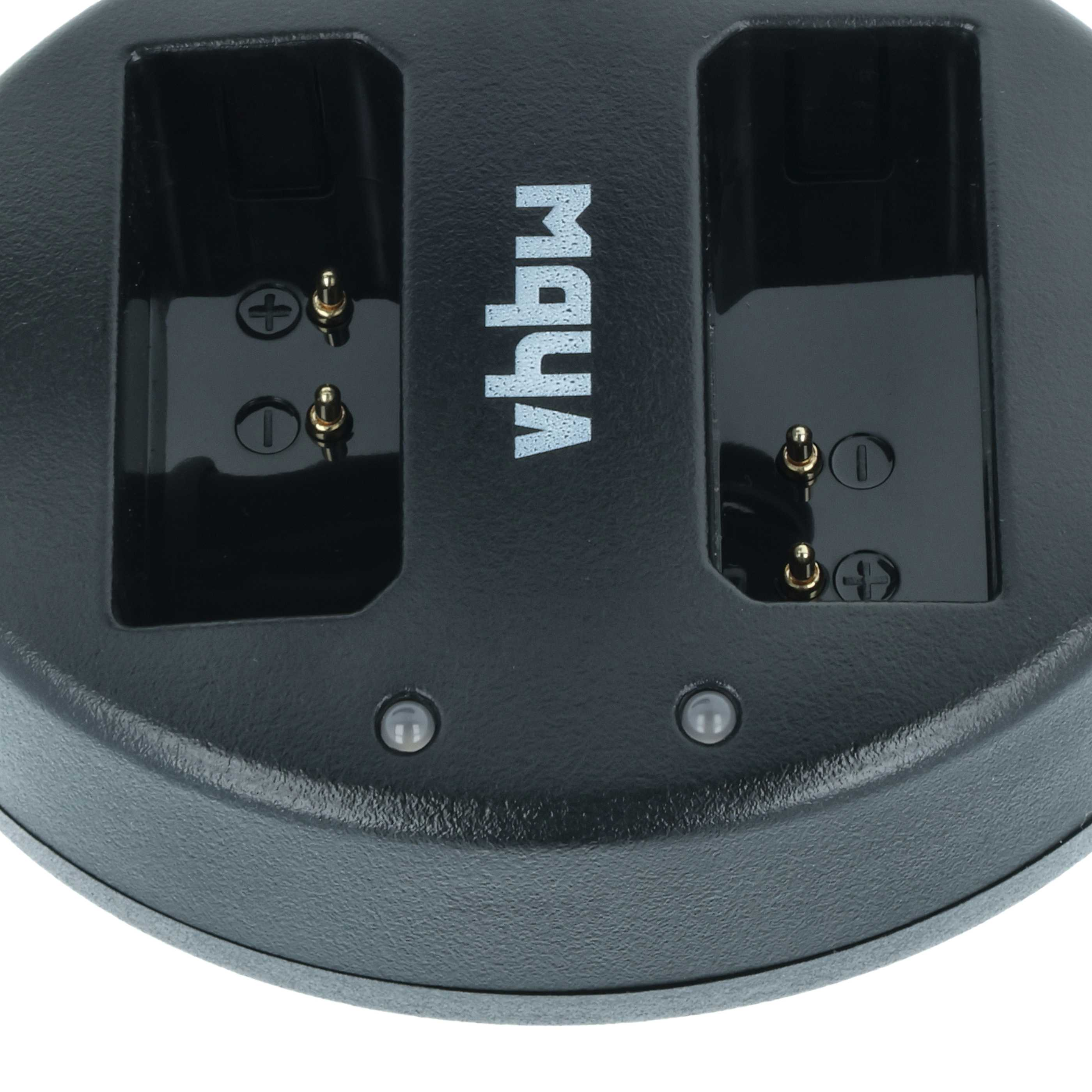 Ein schwarzes Batterieladegerät mit zwei Ladeschächten. Goldstifte sind sichtbar. Der Markenname ist weiß.