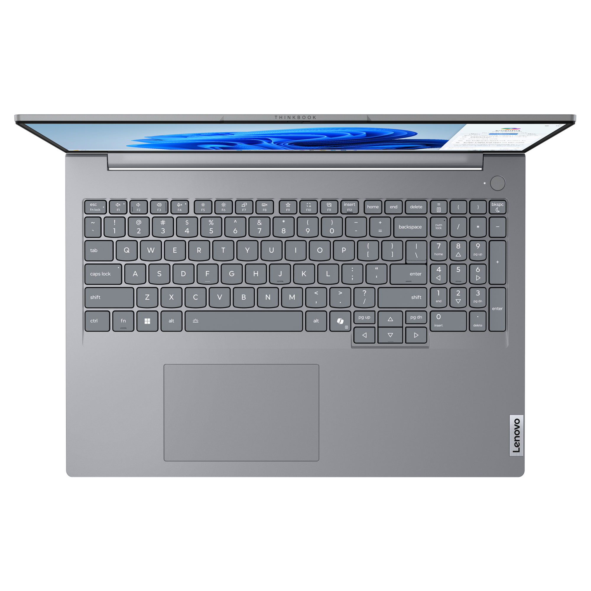 Gri bir Lenovo ThinkBook dizüstü bilgisayar beyaz bir yüzey üzerinde açık. Klavye görünür, ekran yukarıdadır.