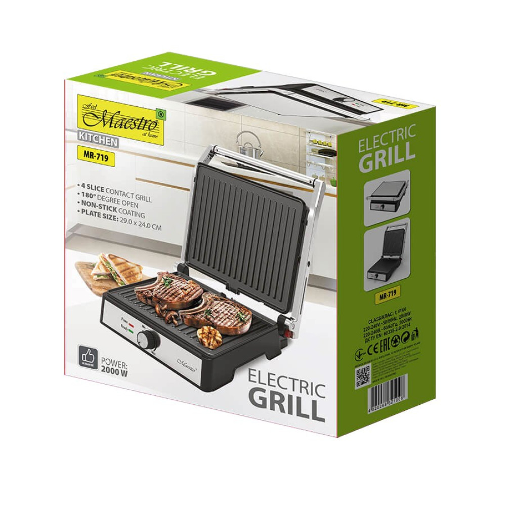 Grill elektryczny w pudełku. Grill jest otwarty, pokazując steki. Tekst na pudełku to 'Electric Grill' i nazwa marki 'Maestro'.