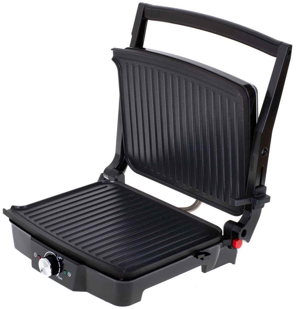 Czarna prasa do panini jest otwarta, ukazując żebrowane powierzchnie do gotowania. Ma uchwyt i pokrętło sterowania. Tło jest białe.