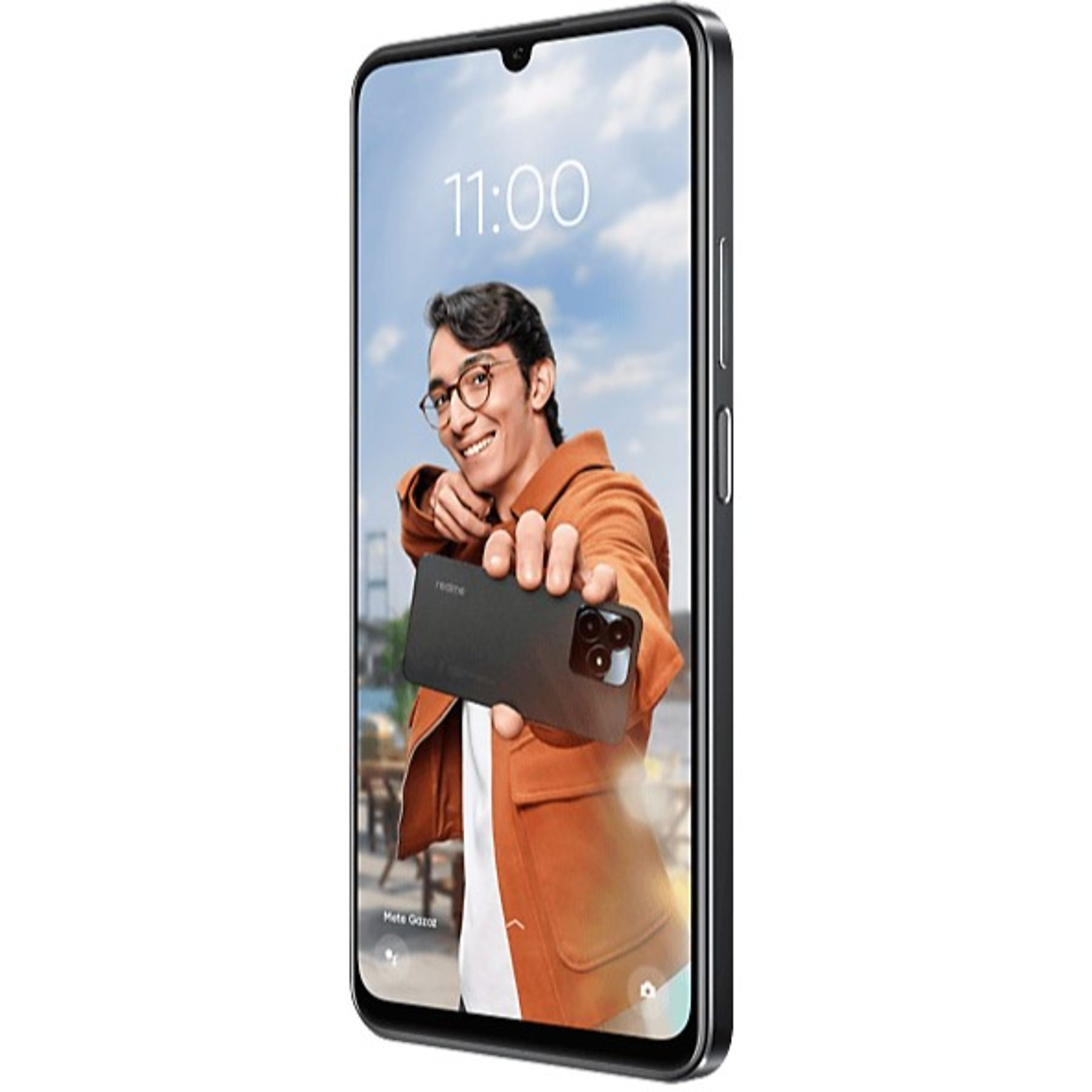 Gülümseyen, telefon tutan bir adam. Telefonda saat 11:00 yazıyor. Adam gözlüklü ve kahverengi ceketli.