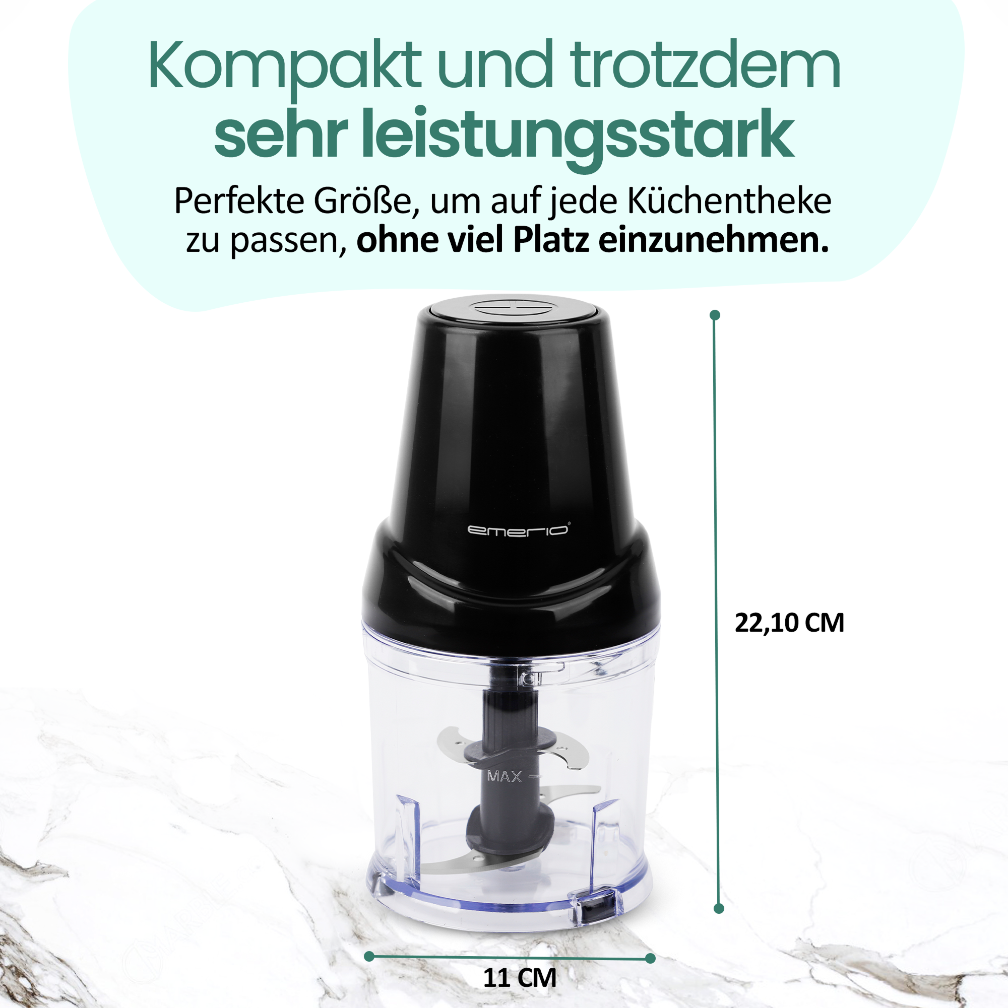 Ein schwarzer und transparenter Food Processor. Er hat Klingen im Inneren. Er steht auf einer weißen Marmoroberfläche.