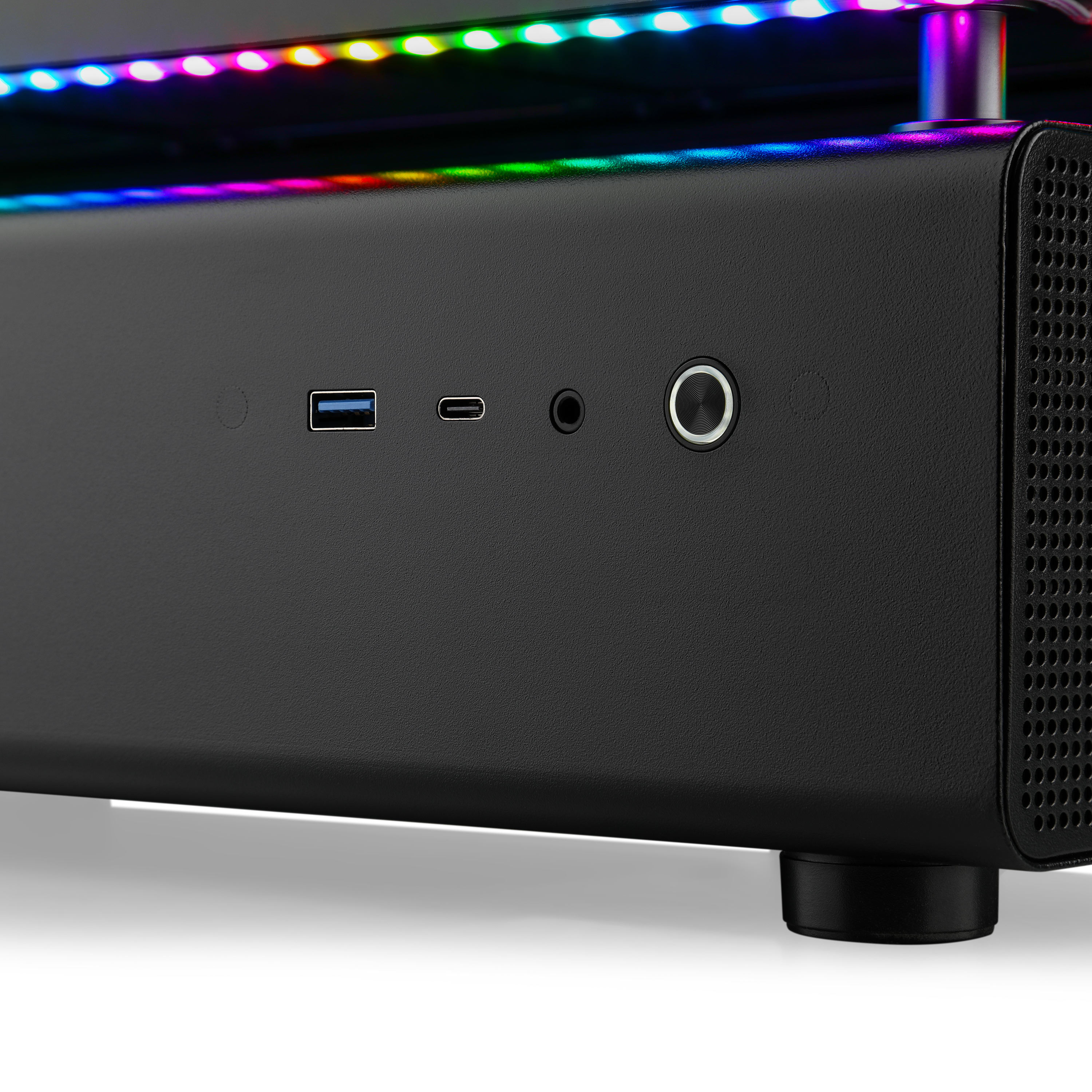 Schwarzes Gerät mit USB-, USB-C- und Audioanschlüssen. Bunter LED-Streifen oben. Rechte Seite hat Lüftungslöcher.