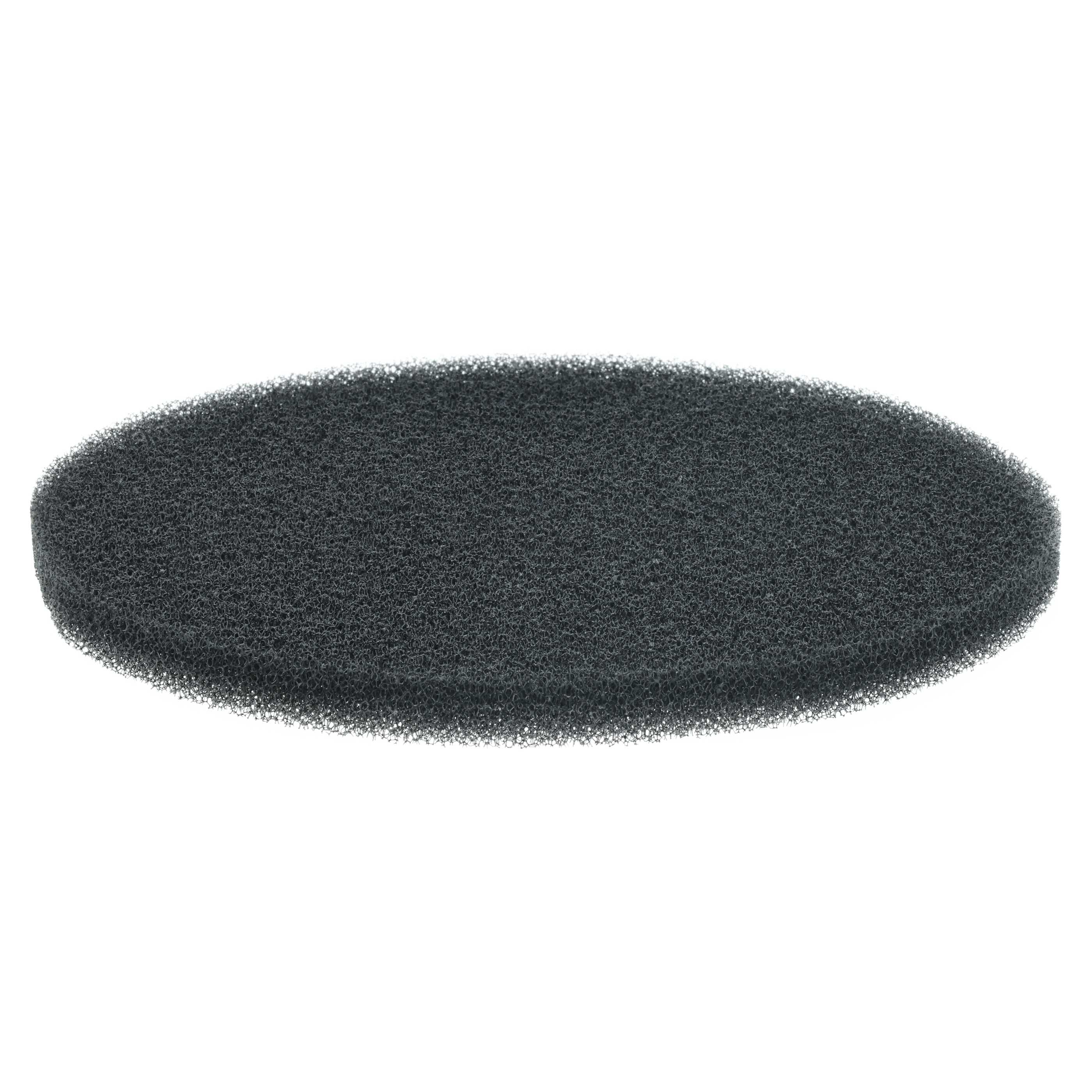 Ein dunkelgrauer, oval geformter Schwamm vor weißem Hintergrund.