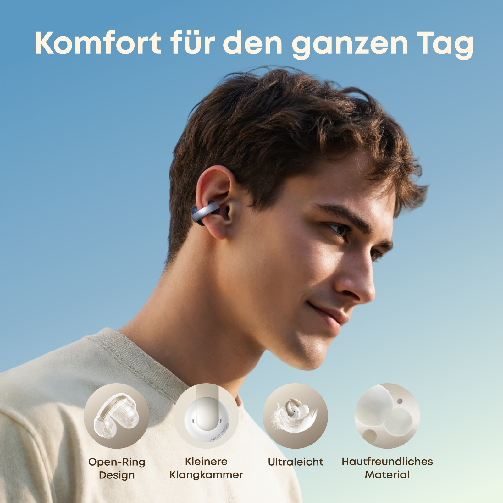 Mężczyzna w słuchawkach, uśmiechnięty. Tekst: komfort na cały dzień. Cechy: konstrukcja z otwartym pierścieniem, lekka, przyjazna dla skóry.