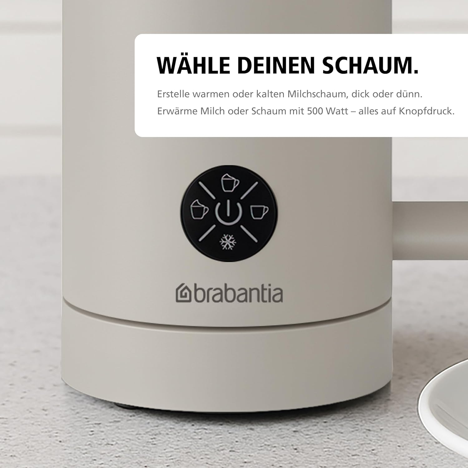 Cremefarbener Milchaufschäumer mit Knöpfen. Text: 'WÄHLE DEINEN SCHAUM.' und 'brabantia' Logo sichtbar.