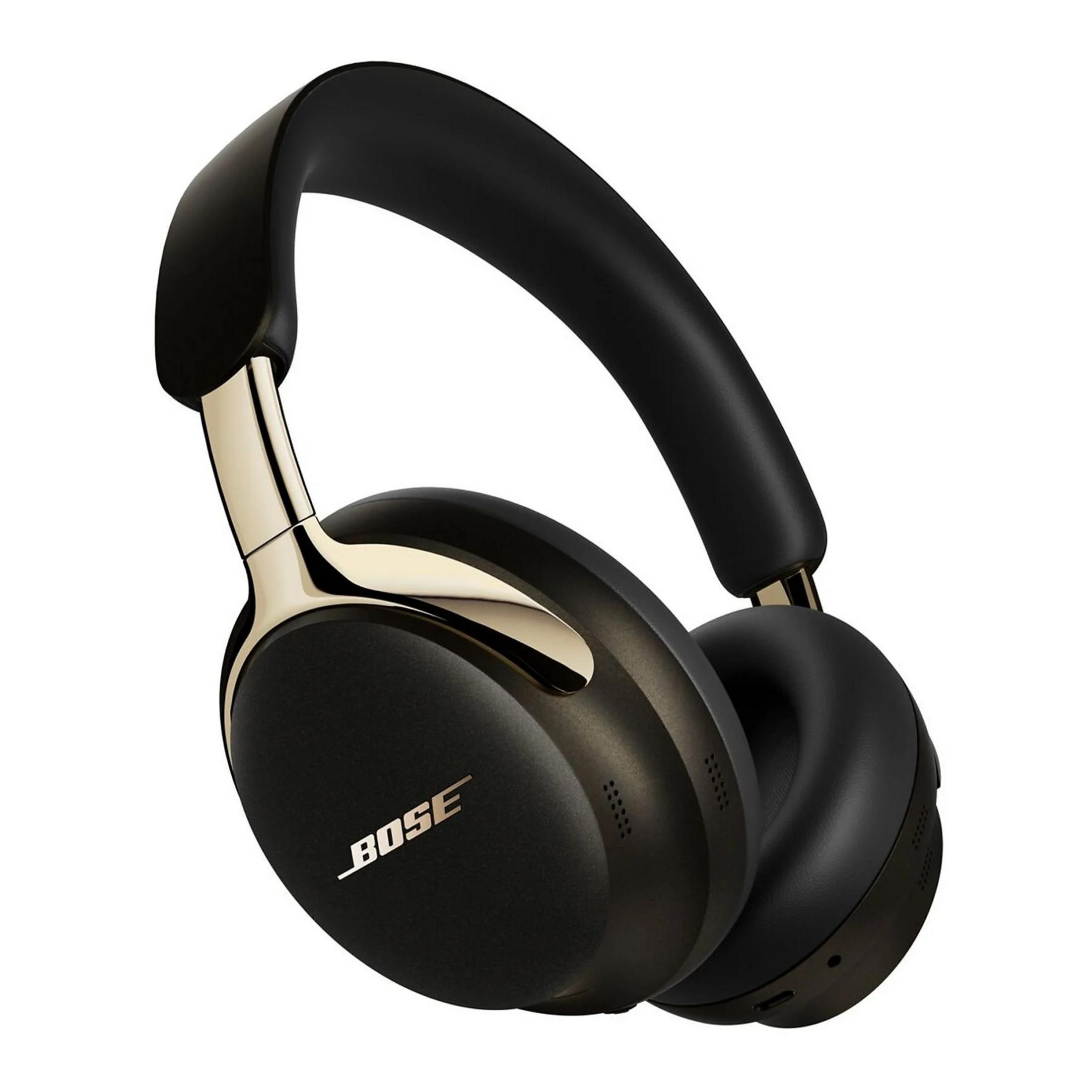 Auriculares Bose negros con detalles dorados. Las orejeras y la diadema son negras. El logotipo de Bose es visible.