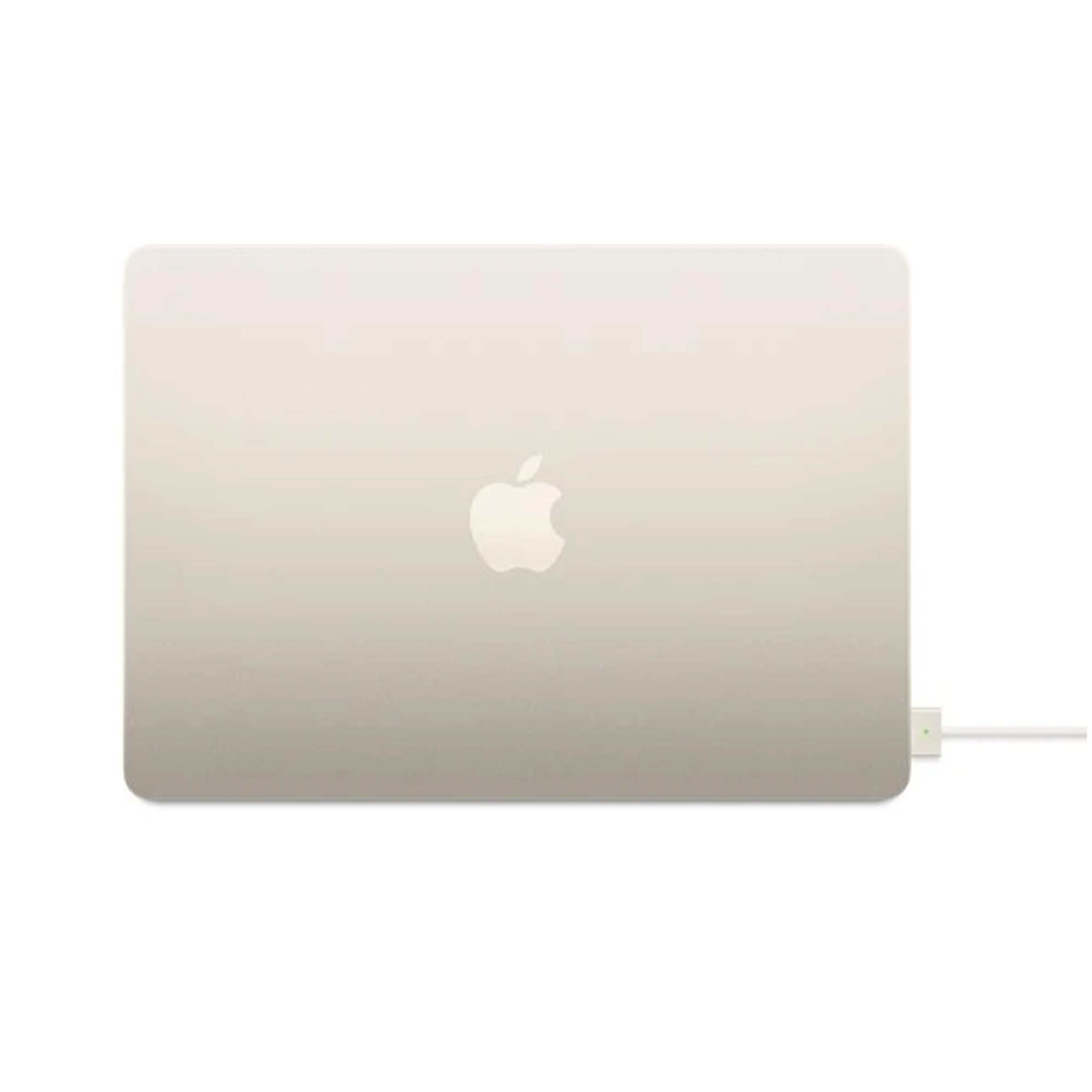 A closed, gold laptop with an Apple logo. A white charger is connected to the side on a white background.