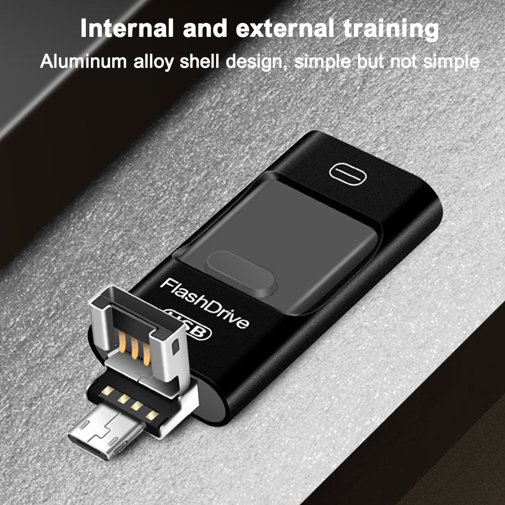 Ein schwarzer FlashDrive-USB-Stick mit freiliegendem Anschluss. Der Hintergrund ist eine strukturierte graue Oberfläche.