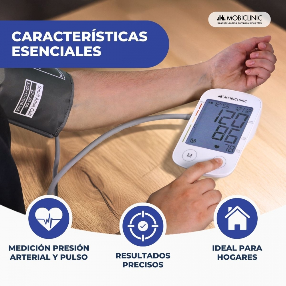 Brazo de una persona con un monitor de presión arterial que muestra lecturas. El monitor es blanco y el brazo está conectado.