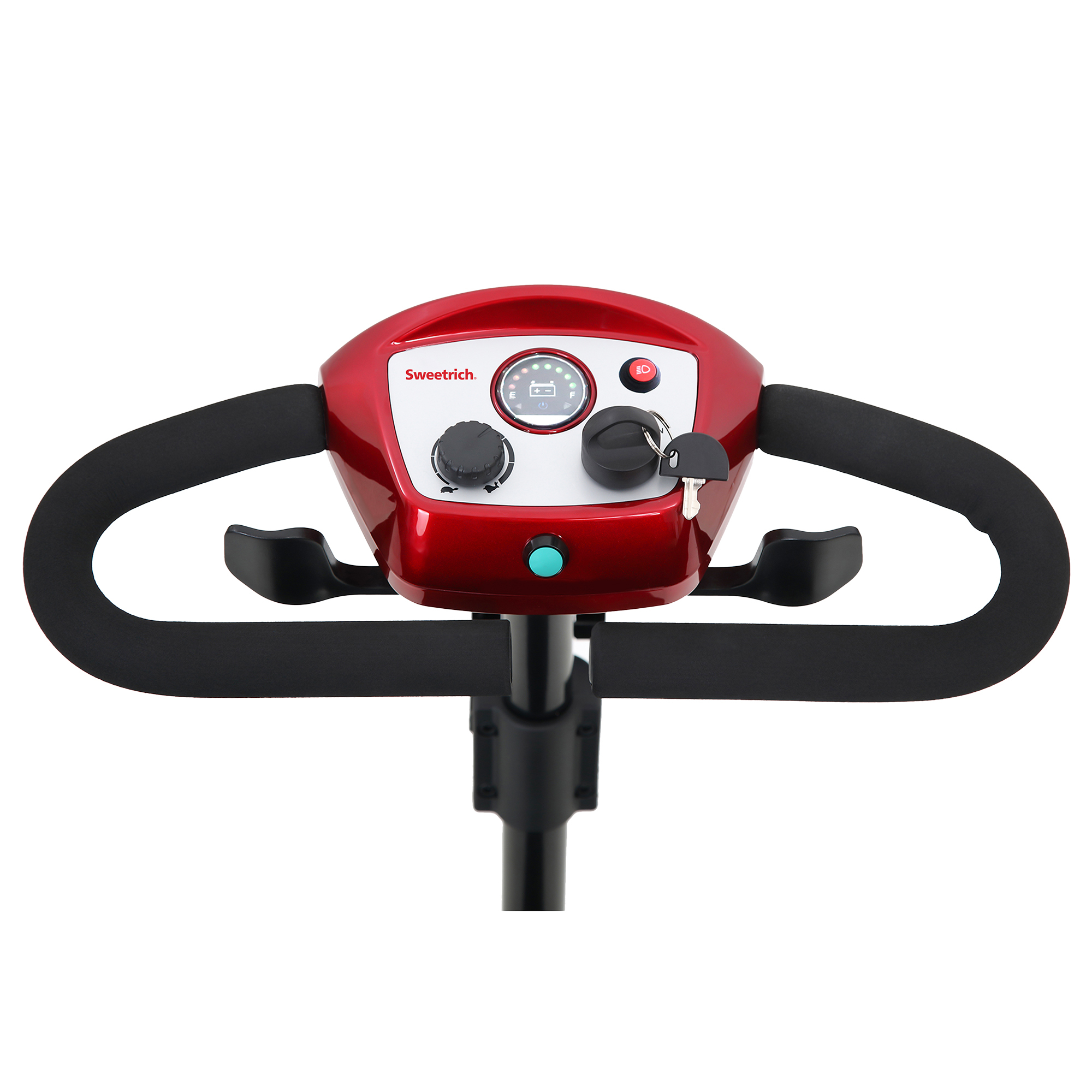 Czerwona kierownica skutera inwalidzkiego z elementami sterującymi, czarne uchwyty. Widoczny zapłon na kluczyk i wskaźnik naładowania baterii.