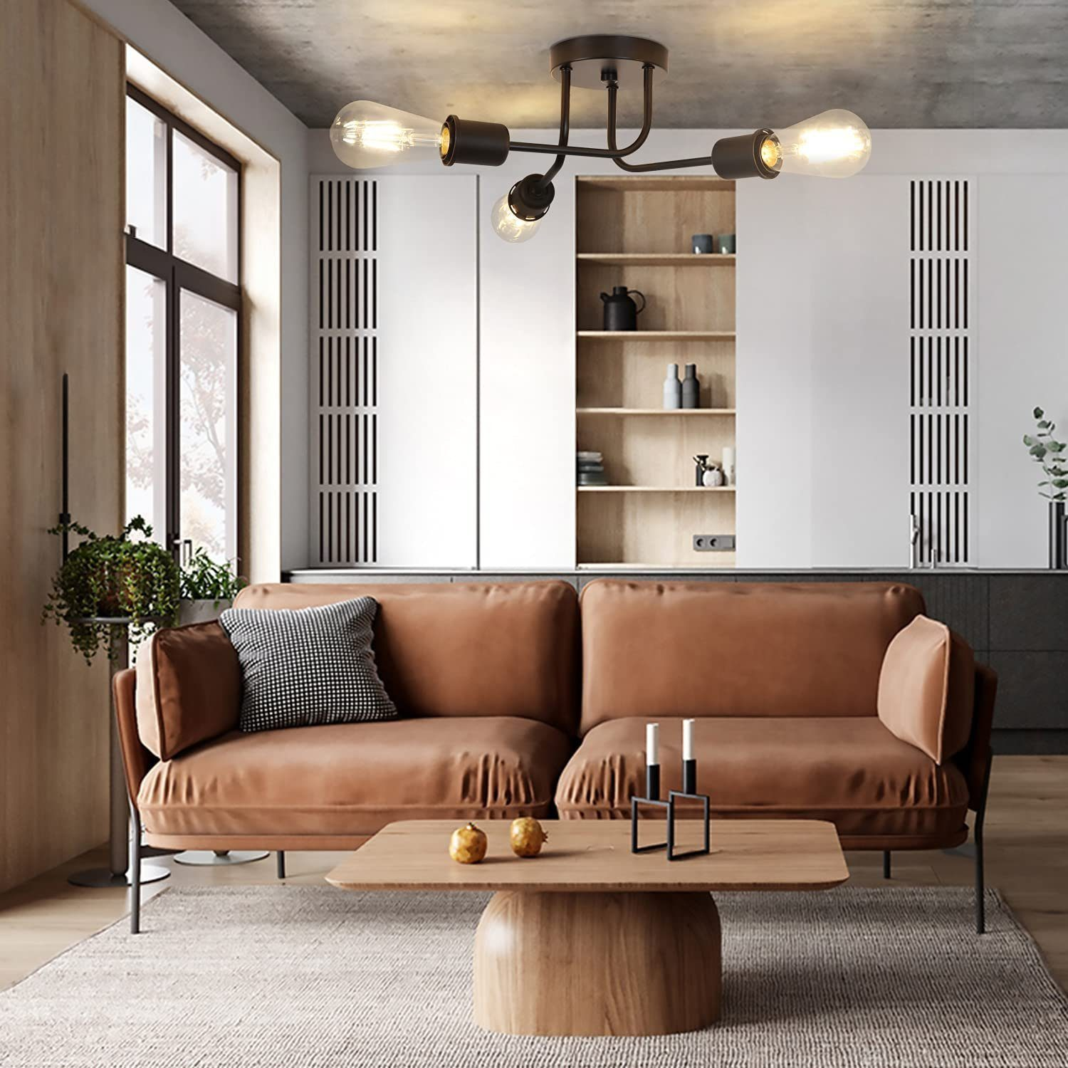 Salón con sofá de cuero marrón, mesa de centro de madera y lámpara negra con bombillas expuestas.