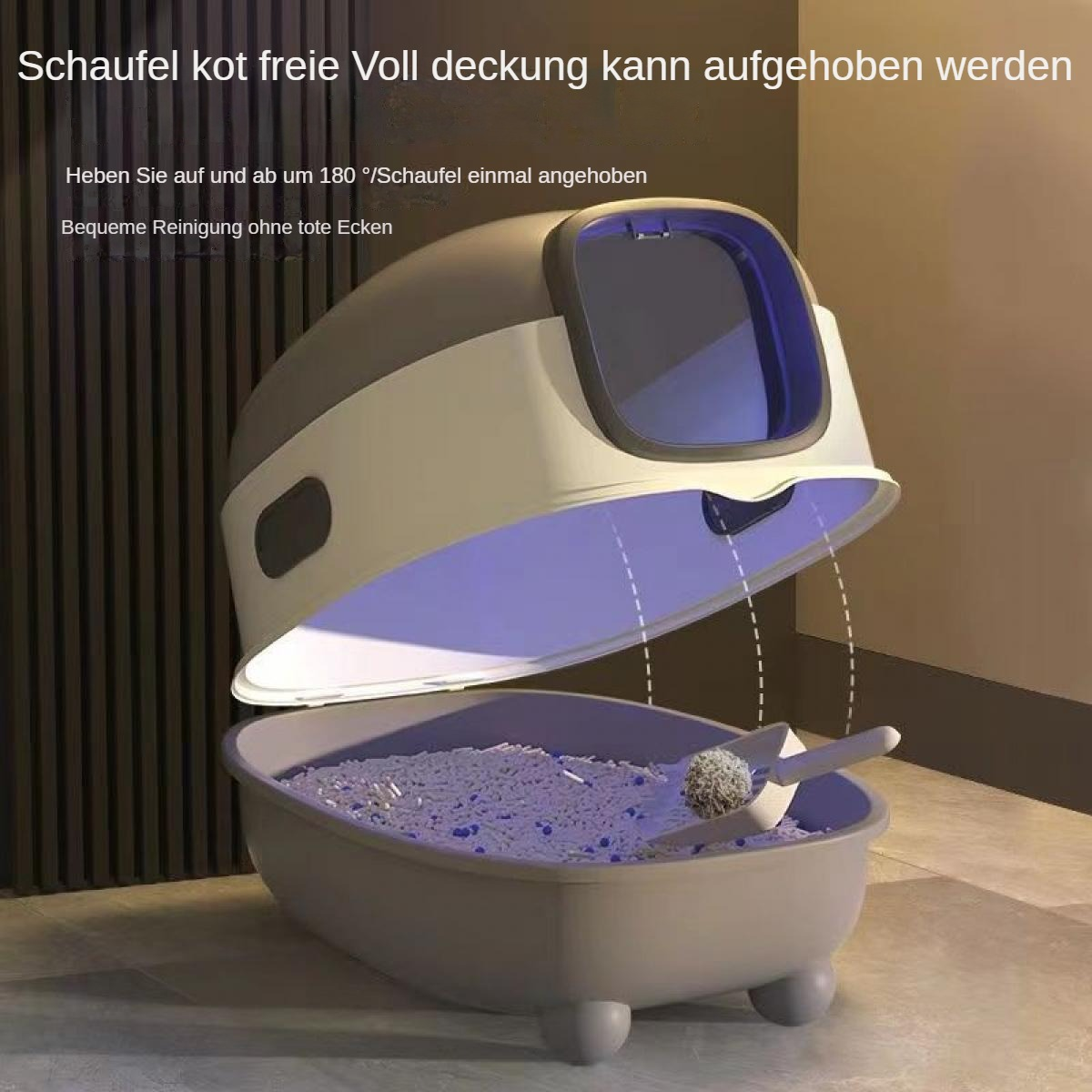 Eine Katzenstreu mit offenem Deckel, der die Streu und eine Schaufel zeigt. Die Box ist grau und weiß, mit einer Schaufel darin.