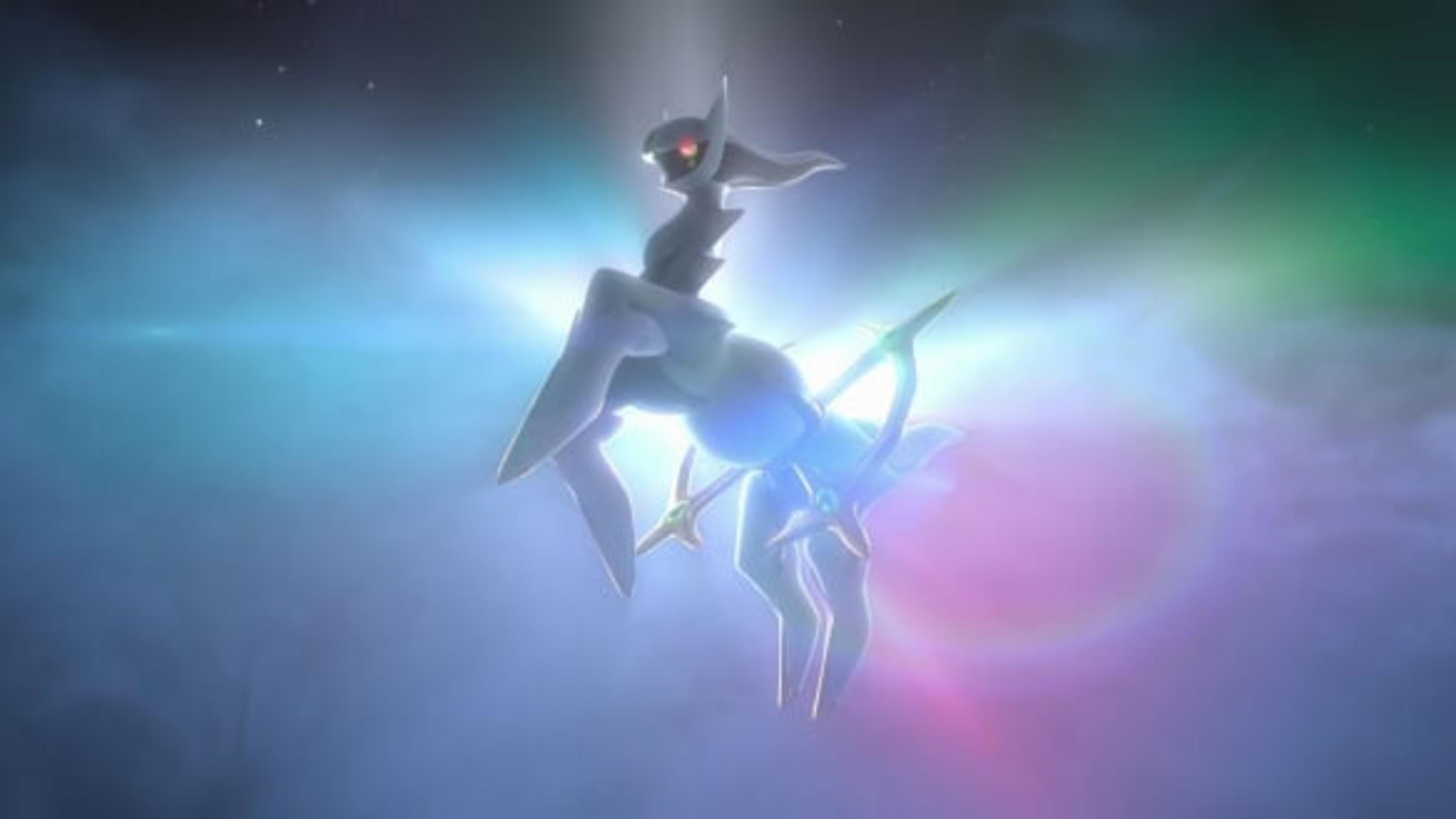 Una creatura simile ad Arceus fluttua in uno spazio luminoso ed etereo. Ha un corpo bianco, occhi rossi e una struttura blu e oro brillante.
