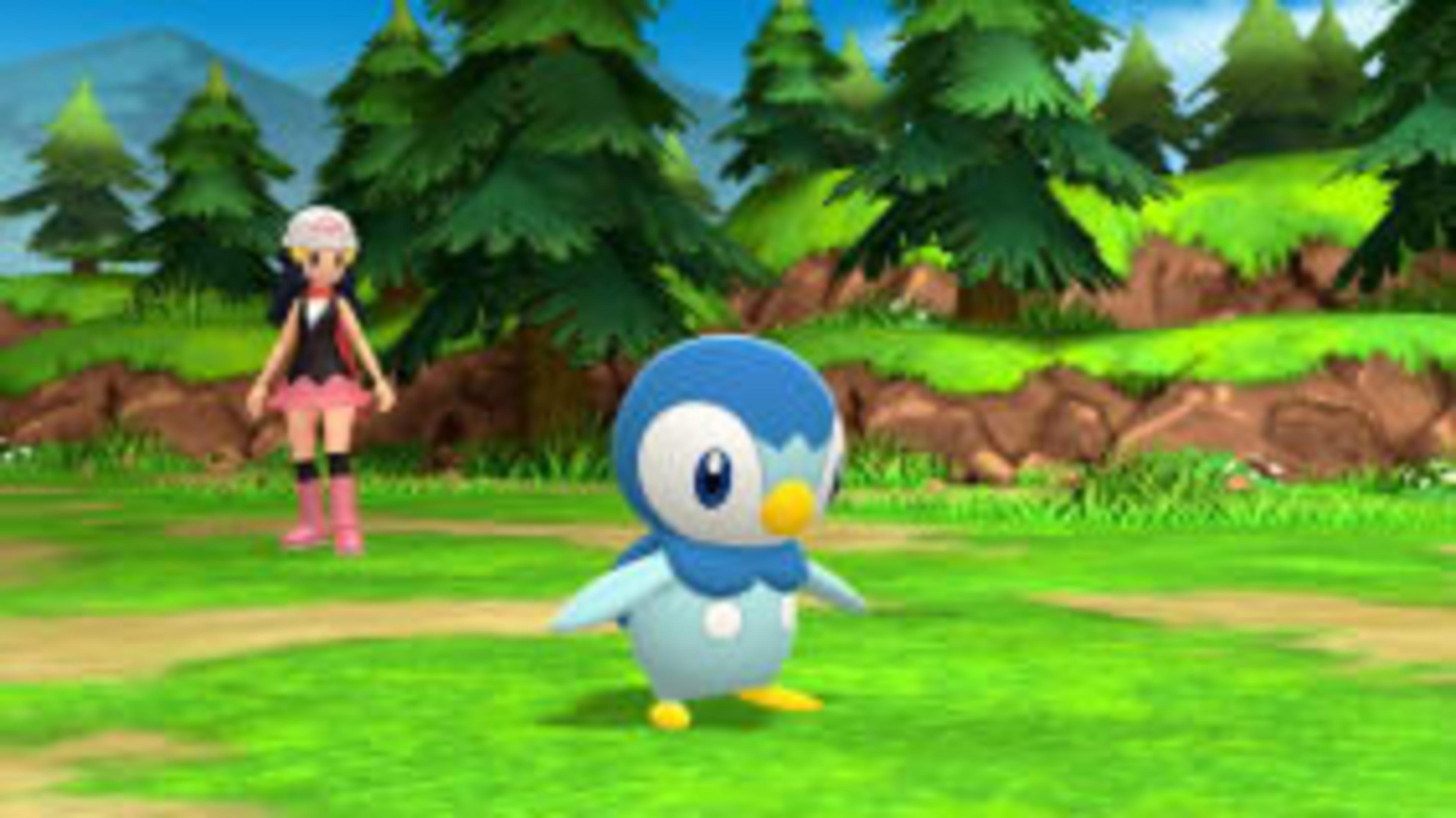 Un Piplup è sull'erba, con un allenatore sullo sfondo. Sono presenti anche alberi e un paesaggio montuoso.