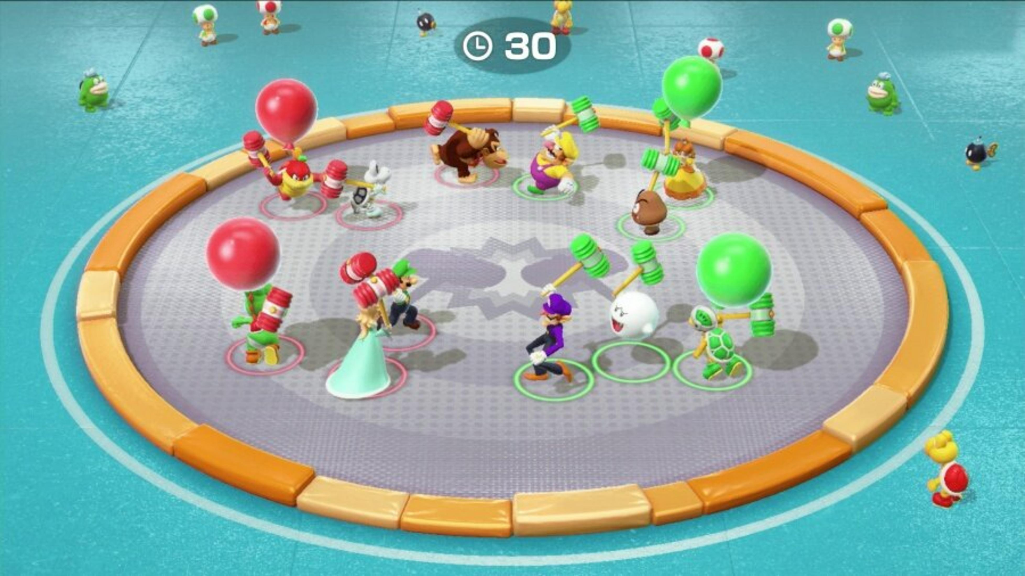 Mario Party-Szene mit Charakteren, die Hämmer, Ballons und Bomben halten. Charaktere befinden sich auf einer kreisförmigen Plattform.