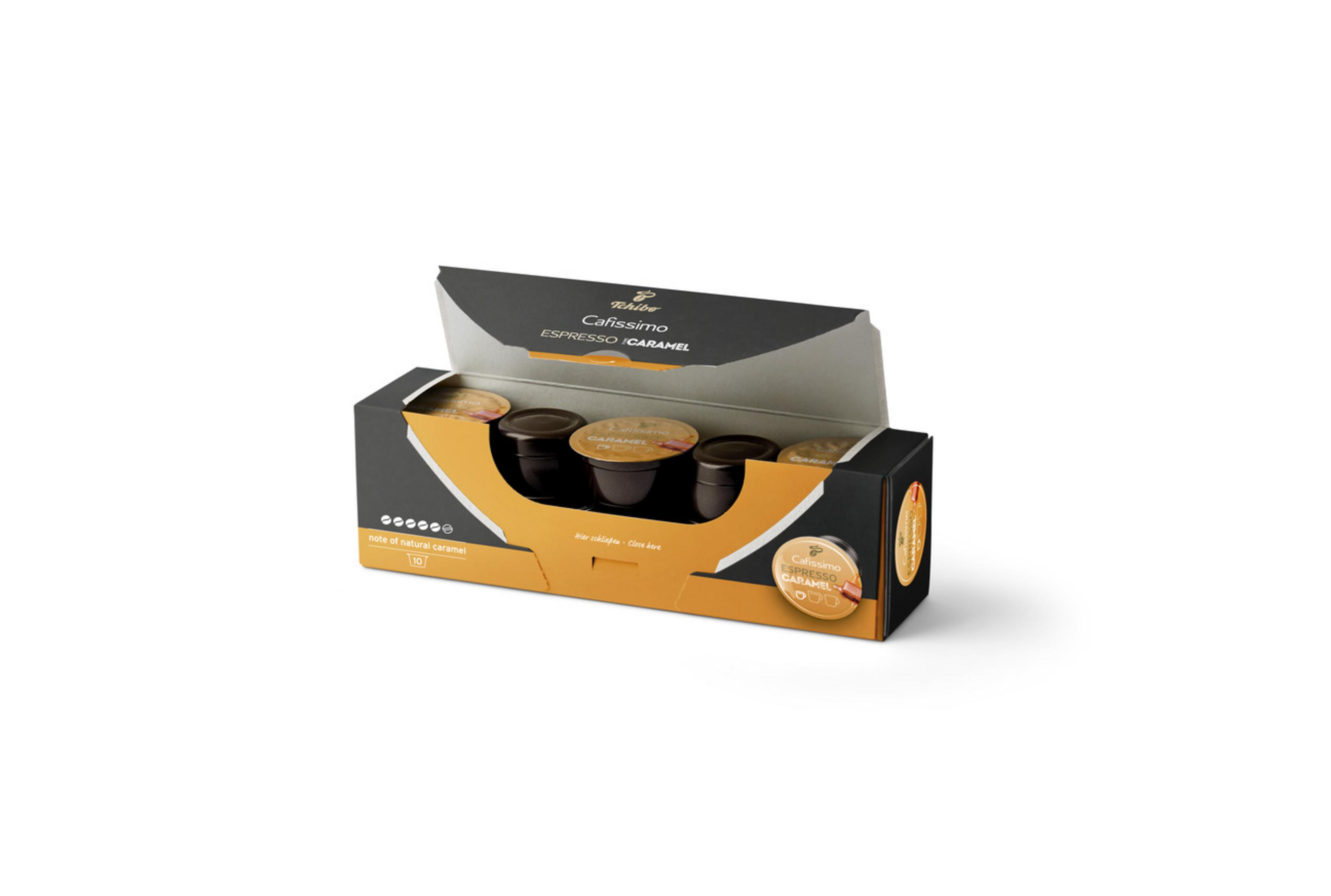 Scatola di capsule di caffè Tchibo Cafissimo Espresso Caramel. Confezione nera e oro. Capsule visibili all'interno.