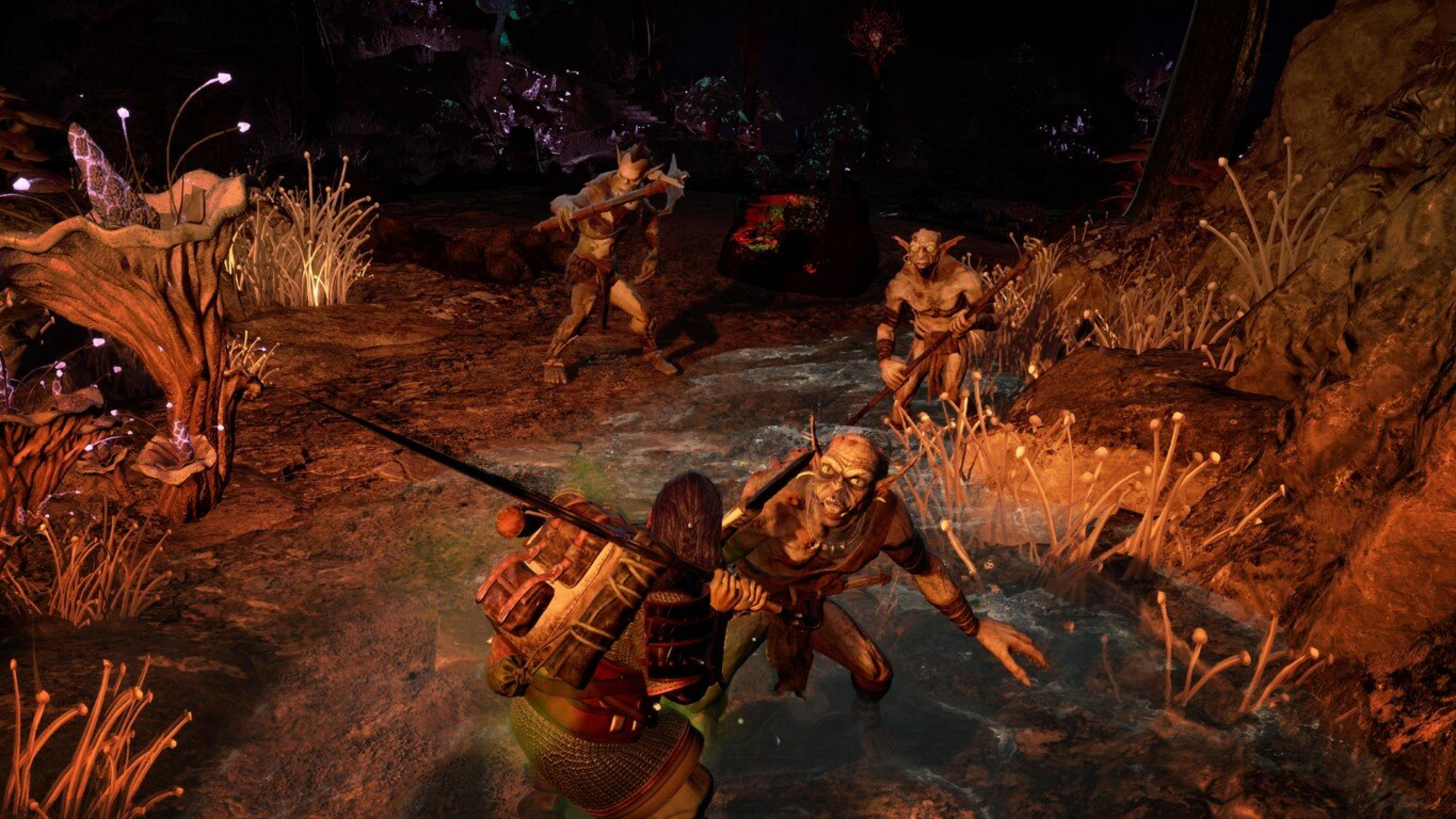 Mroczna scena w jaskini z goblinami i wojownikiem. Wojownik walczy z goblinami zbrojnymi. W tle świecące rośliny.