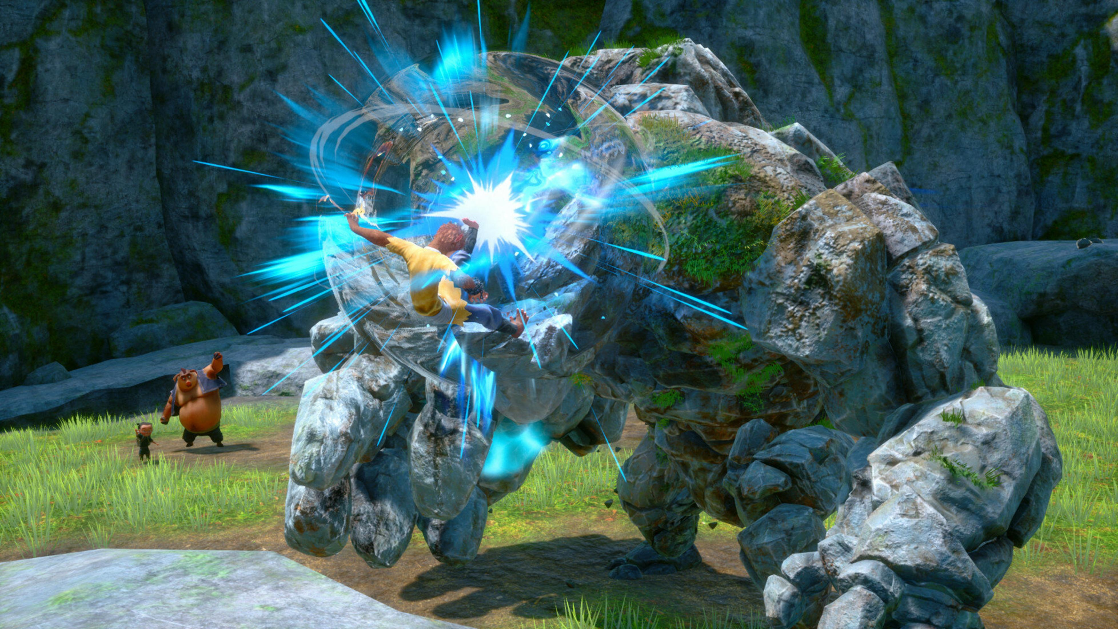 Postać w żółtej koszuli walczy w powietrzu z dużym kamiennym golemem. Niedźwiedzie obserwują z trawiastych pól.