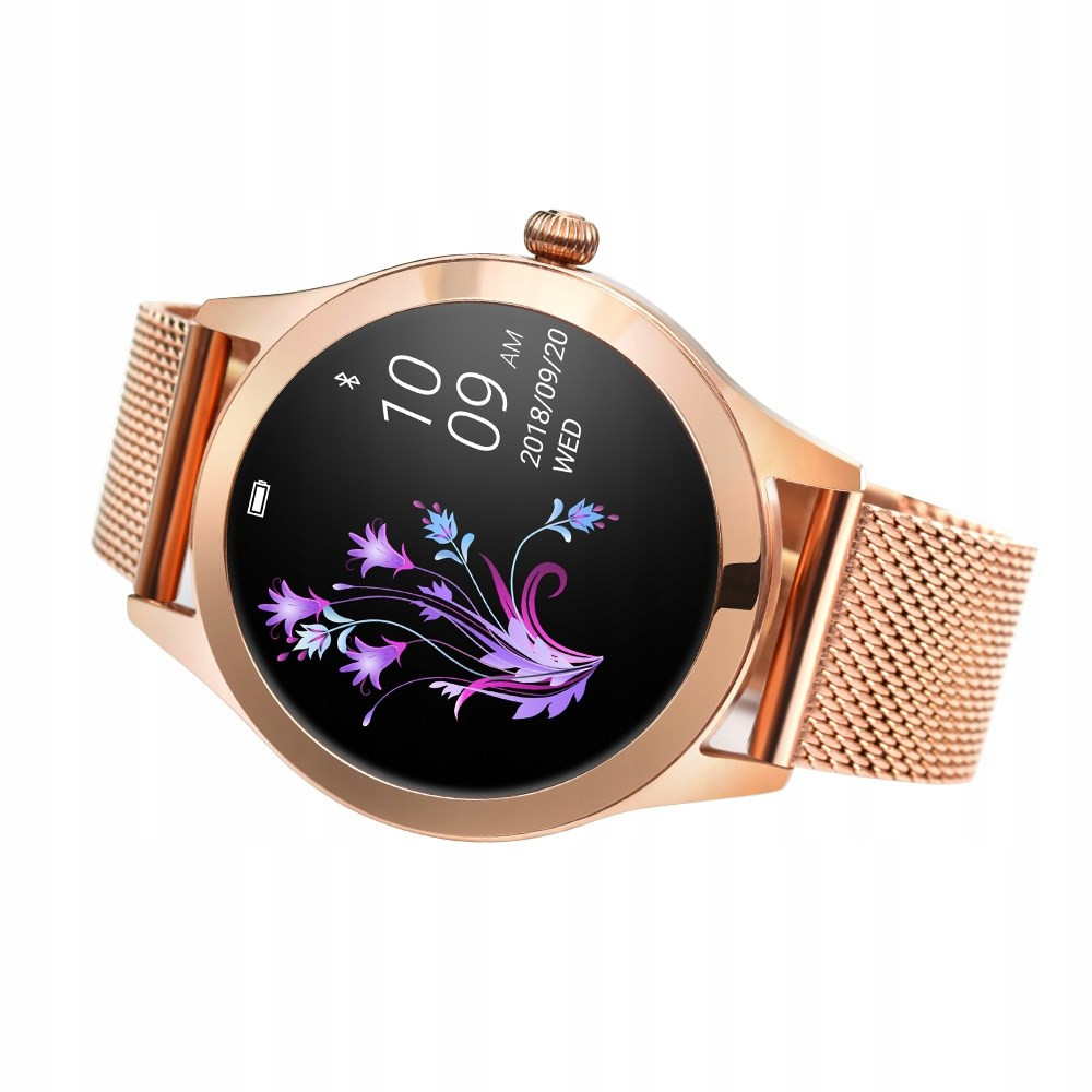 Uno smartwatch oro rosa con schermo nero che mostra ora, data e un design floreale. Il cinturino è a rete.