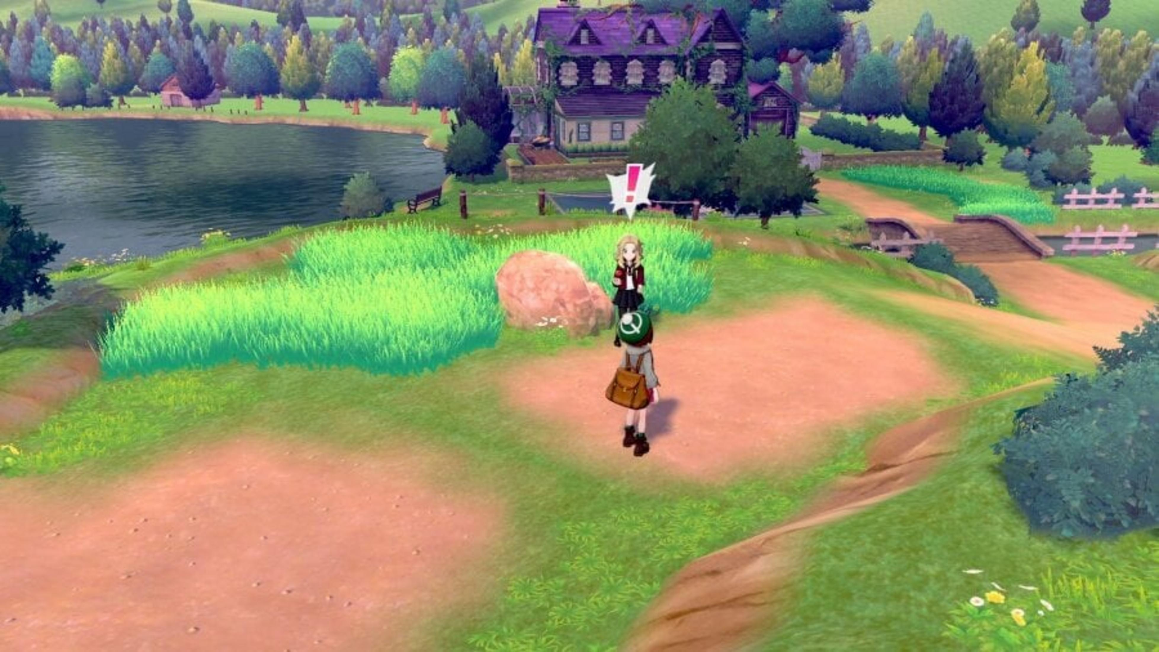 Una scena di gioco con personaggi di fronte a una casa, un lago e alberi. L'erba e un sentiero conducono a un ponte e ad altri alberi.