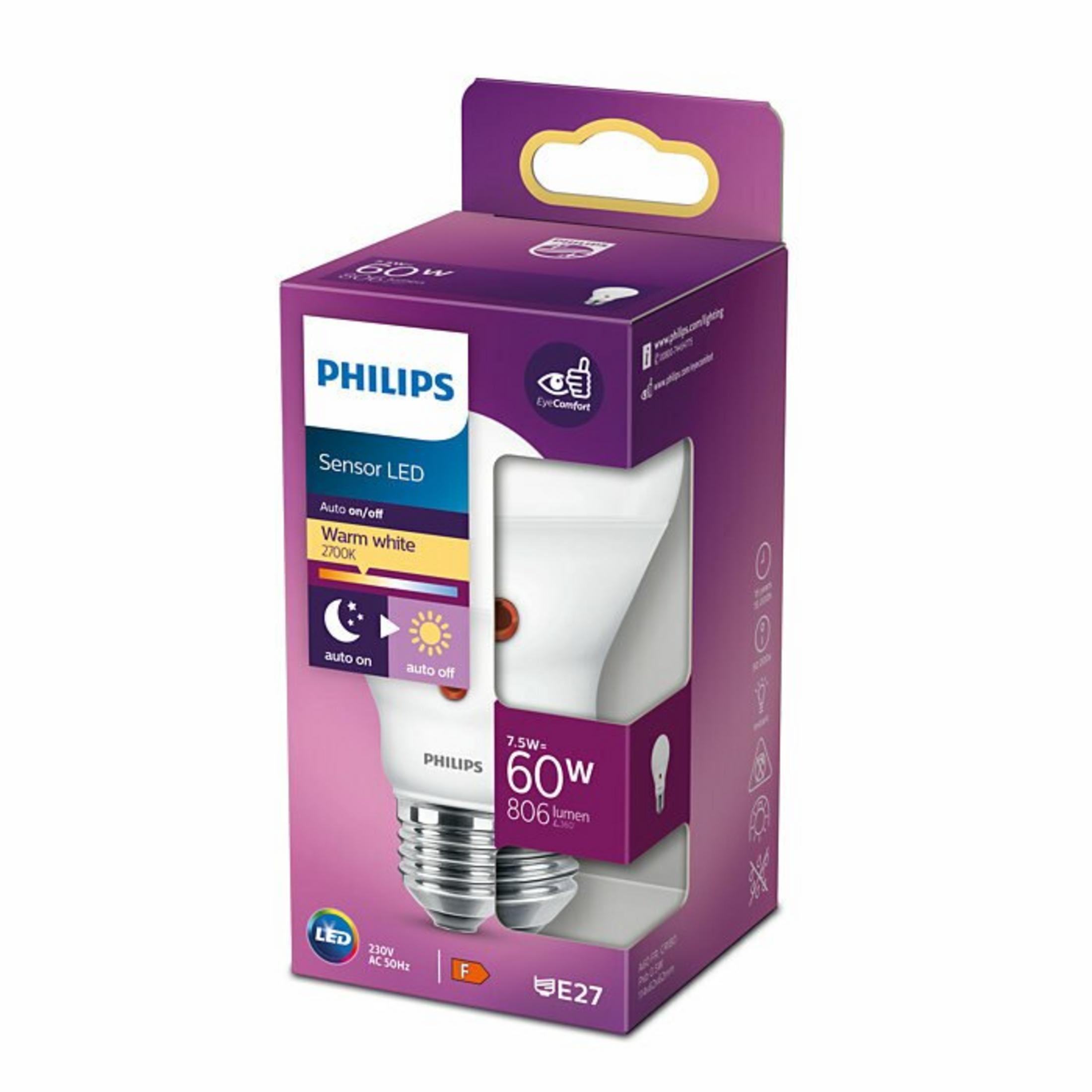 A Philips LED light bulb in a purple and white box. The box has details of the bulb's specifications and features.