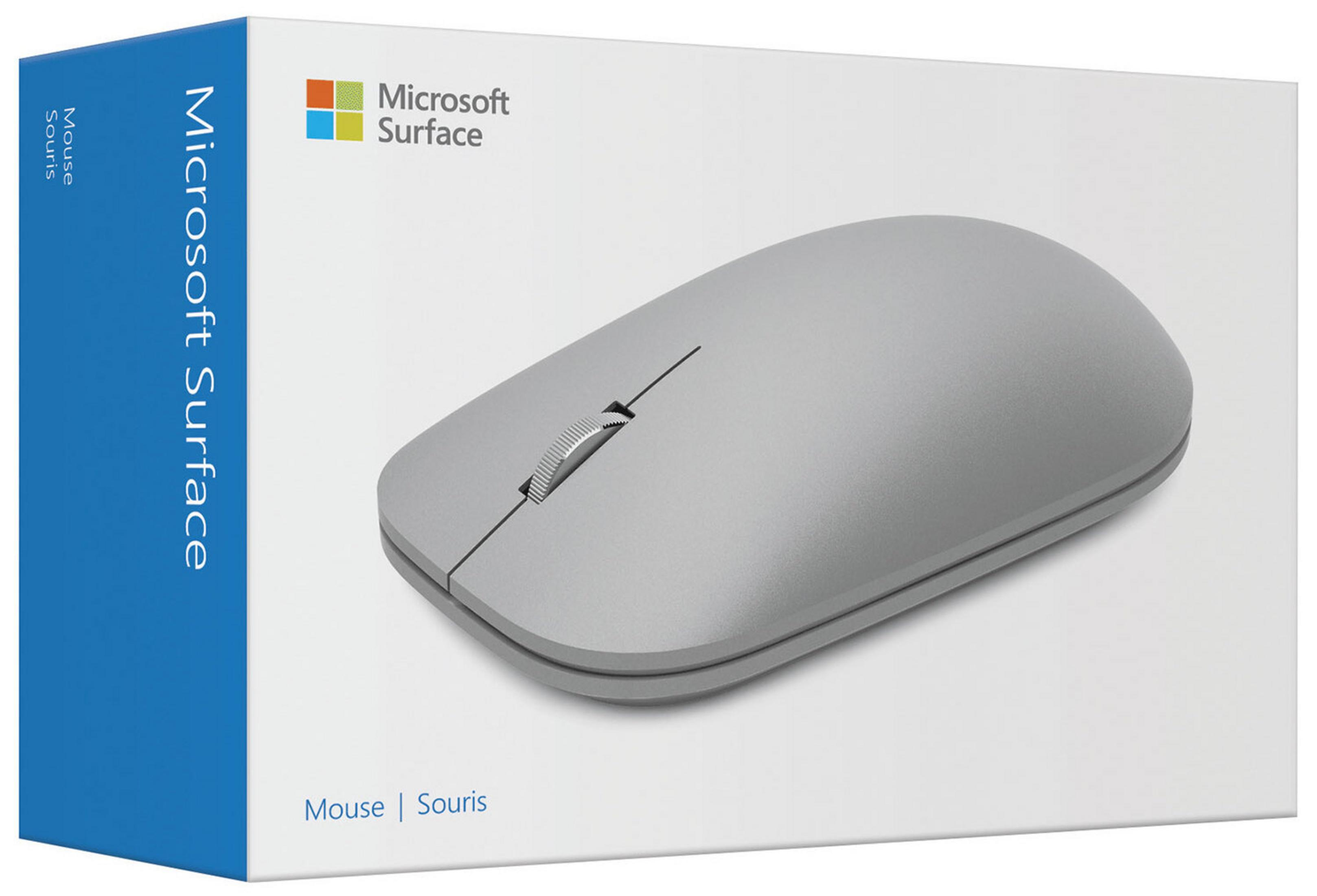 Mysz Microsoft Surface w pudełku. Pudełko jest białe z niebieskim bokiem. Mysz jest szara.